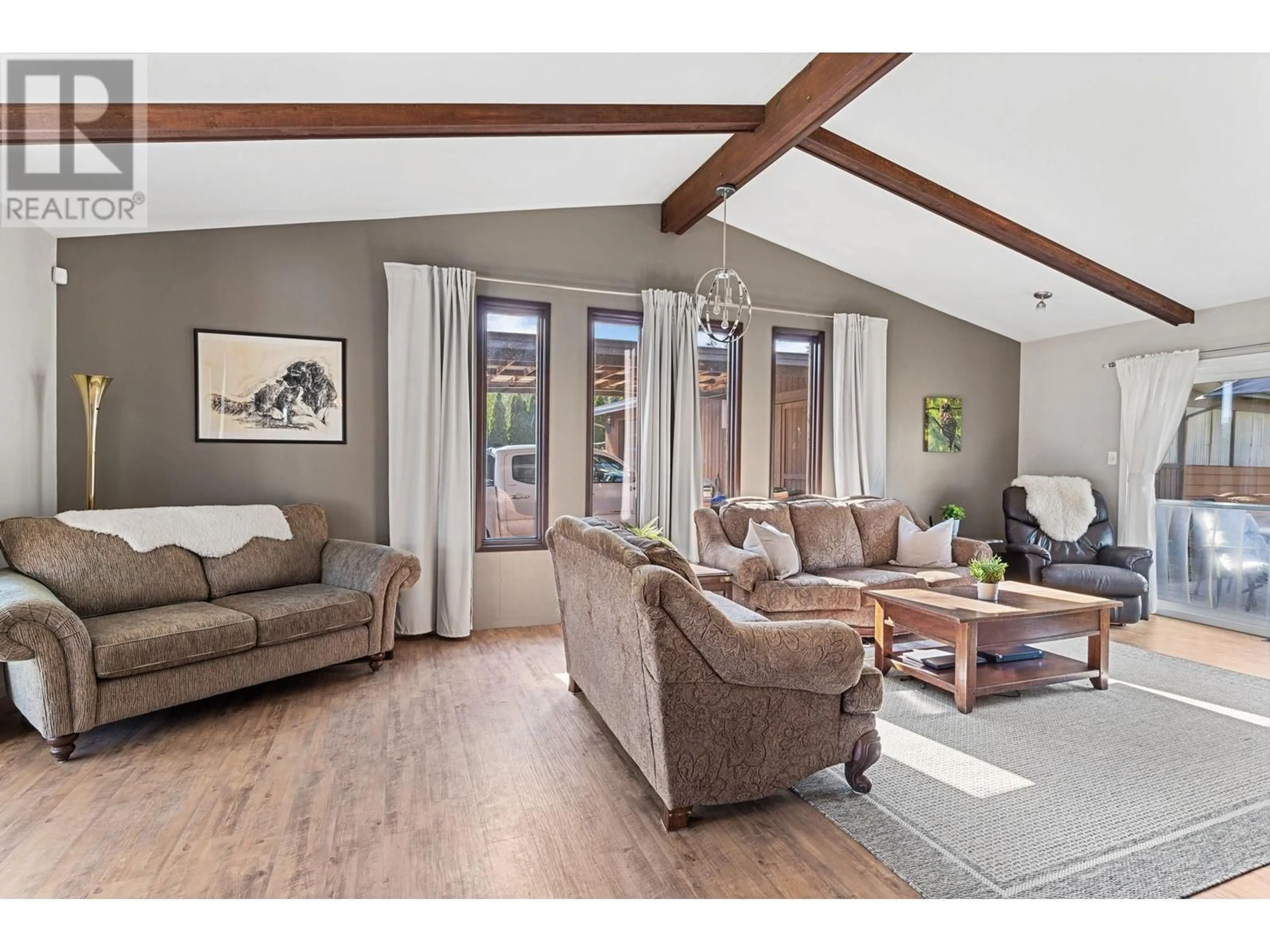 Living room with furniture, wood/laminate floor for 3131 ELLIOTT ROAD, West Kelowna British Columbia V4T1M7