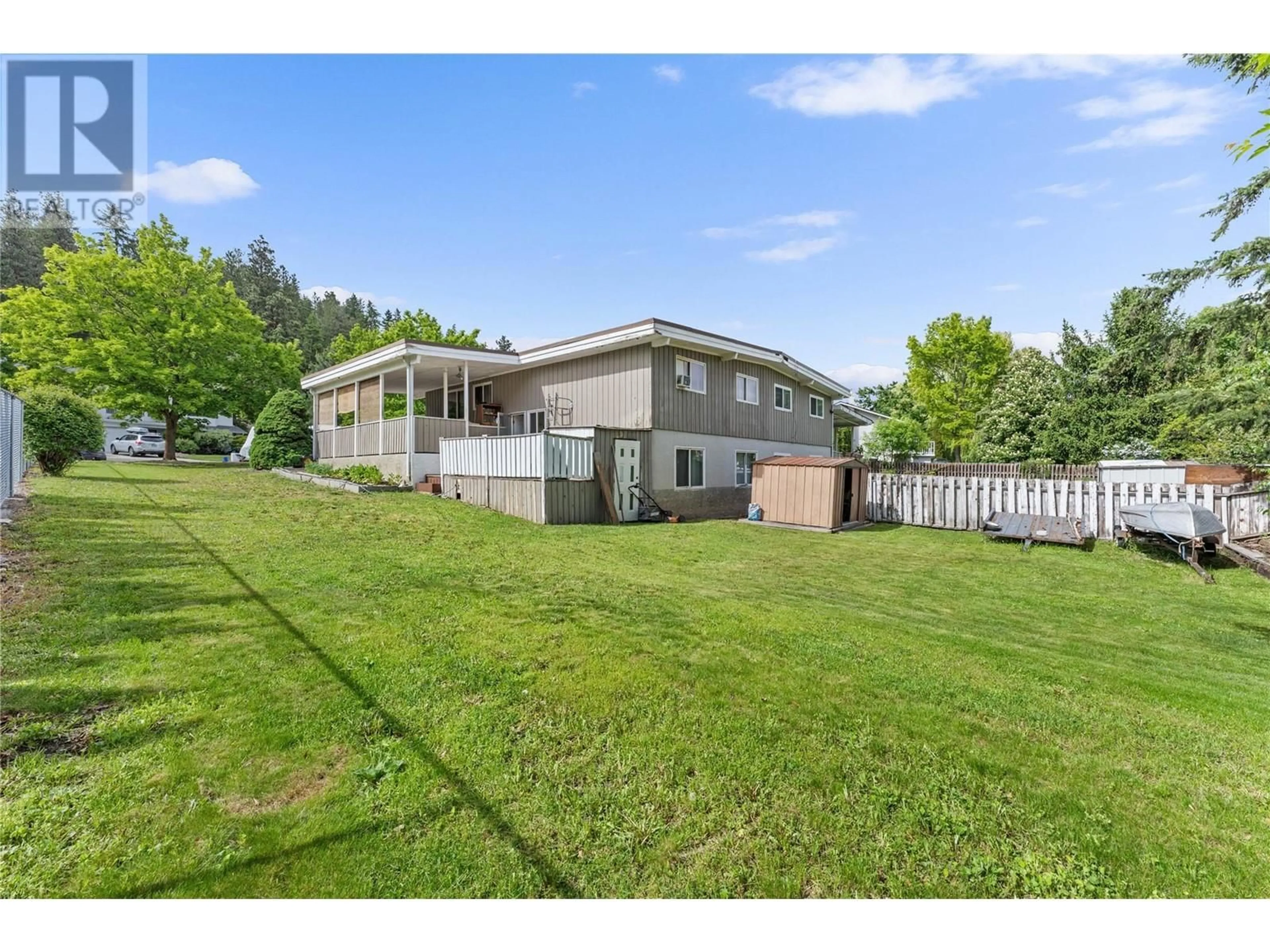 A pic from outside/outdoor area/front of a property/back of a property/a pic from drone, unknown for 155 DRAKE ROAD, Kelowna British Columbia V1V1X2