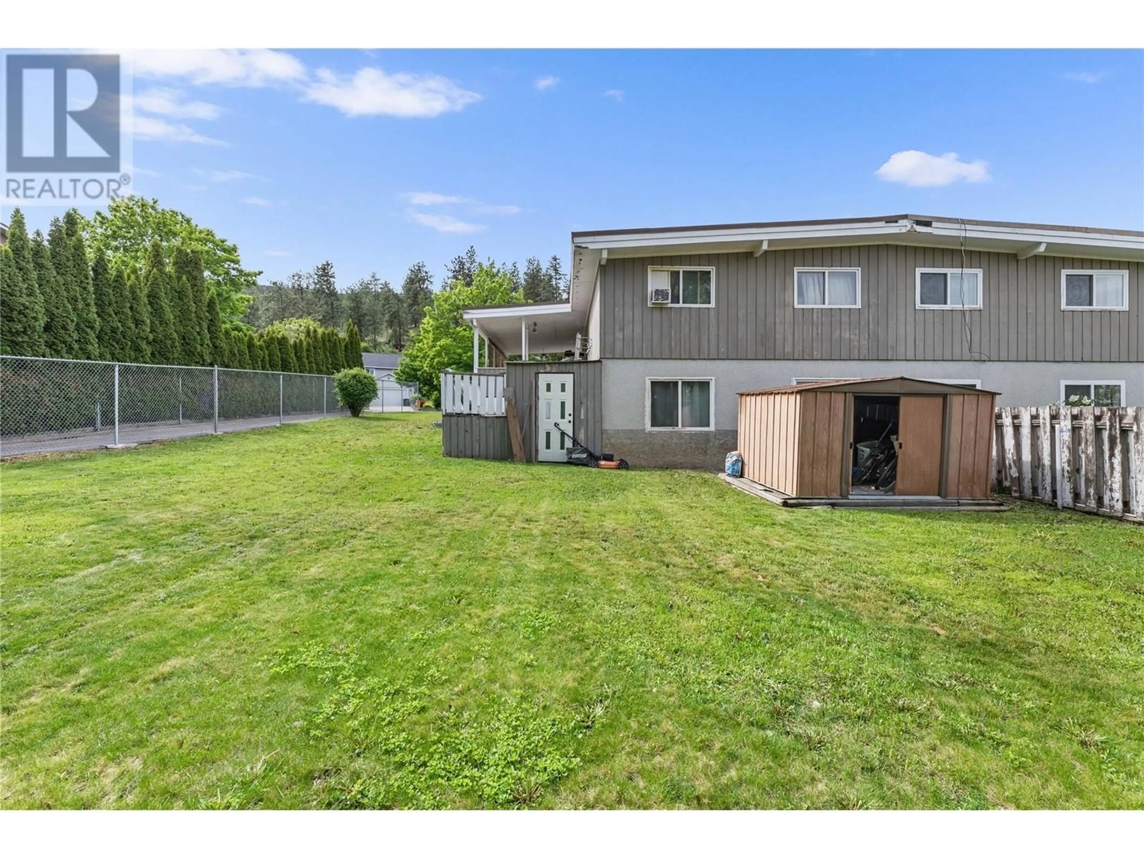 A pic from outside/outdoor area/front of a property/back of a property/a pic from drone, unknown for 155 DRAKE ROAD, Kelowna British Columbia V1V1X2
