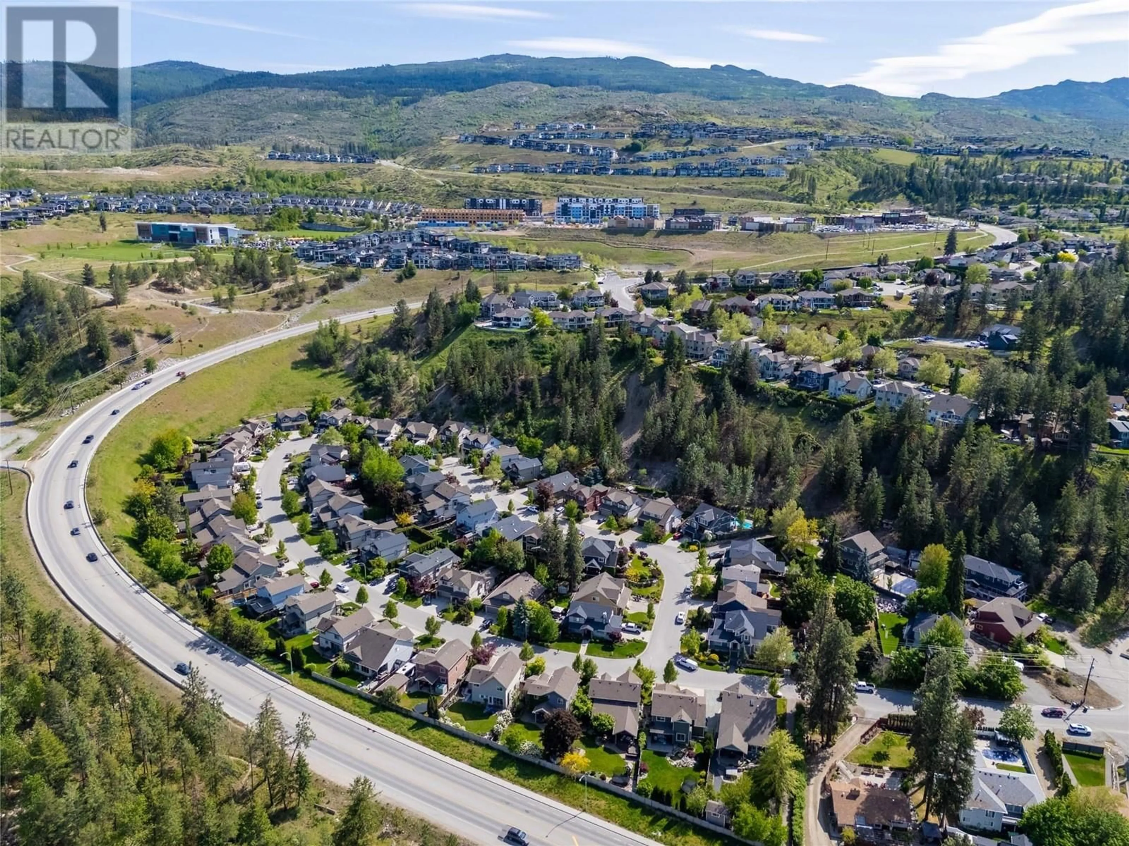 A pic from outside/outdoor area/front of a property/back of a property/a pic from drone, mountain view for 1116 PARET CRESCENT, Kelowna British Columbia V1W4X8