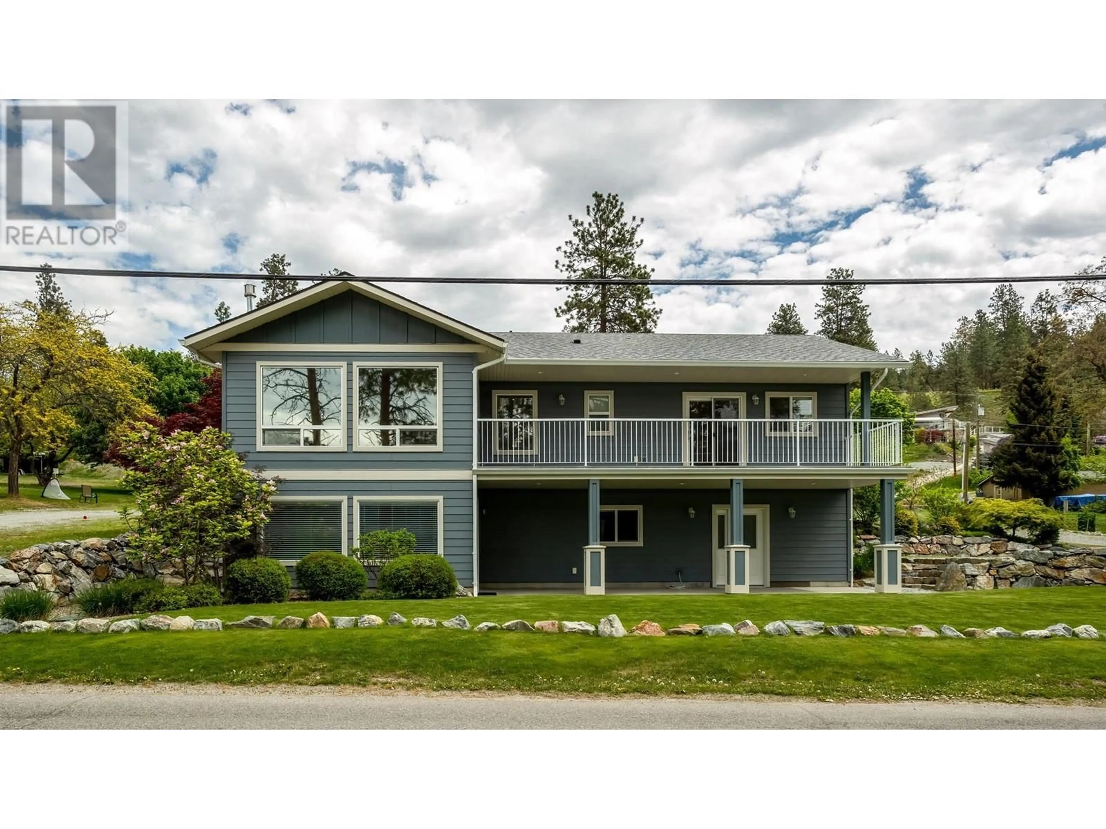 Home with vinyl exterior material, street for 11041 OKANAGAN CENTRE ROAD WEST, Lake Country British Columbia V4V2J7