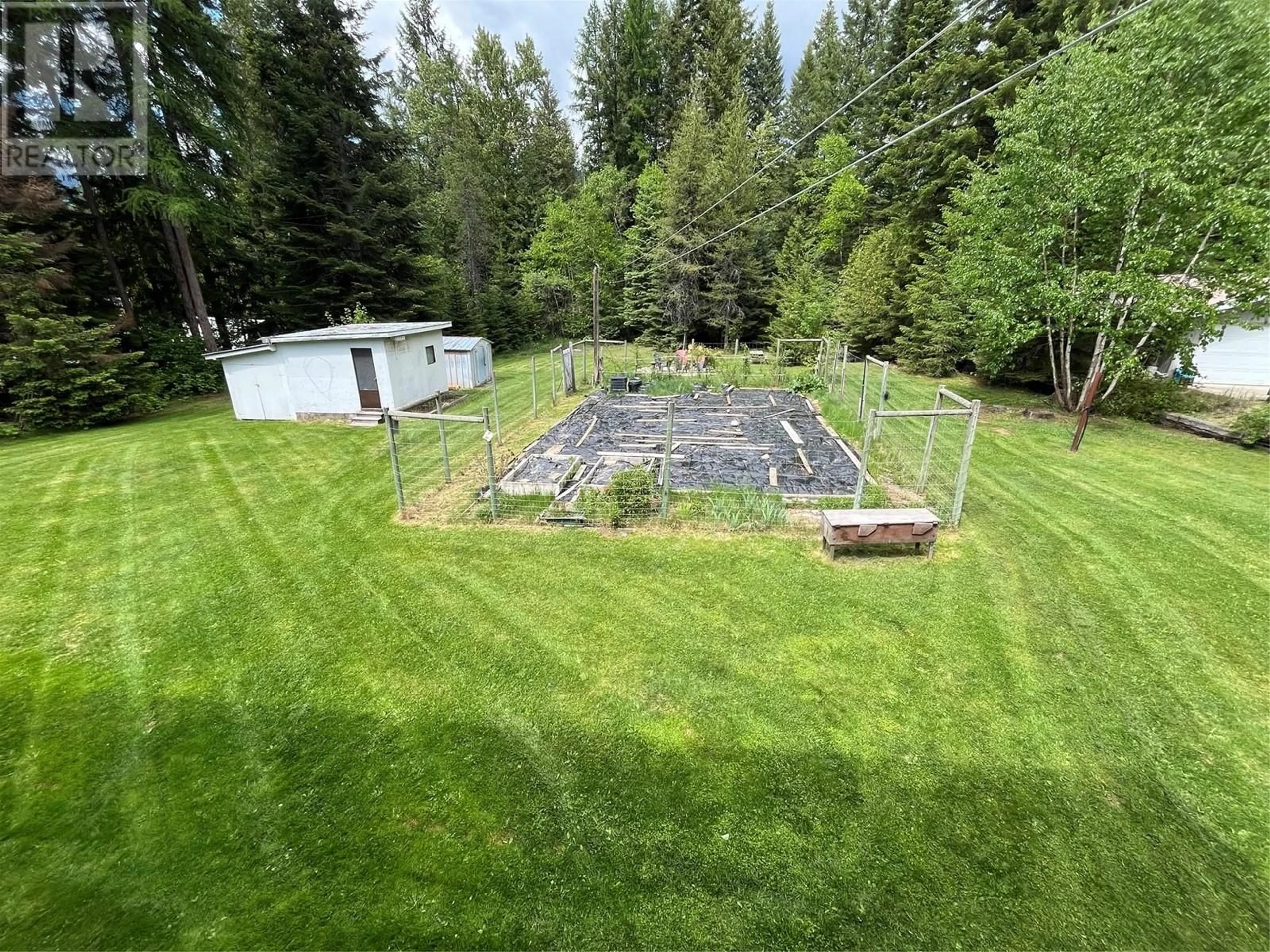 A pic from outside/outdoor area/front of a property/back of a property/a pic from drone, forest/trees view for 1050 WEBB ROAD, South Slocan British Columbia V0G2G0