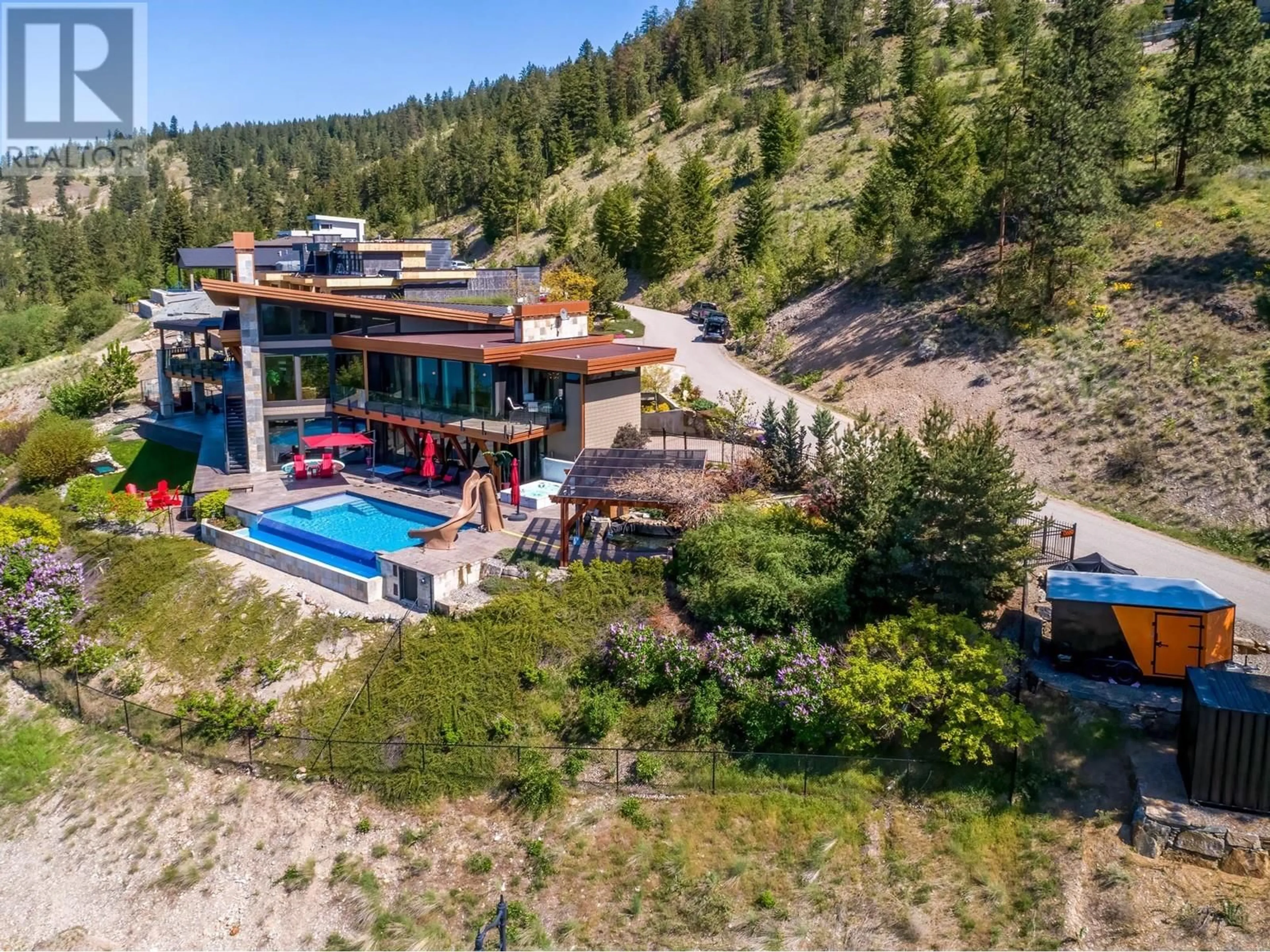 A pic from outside/outdoor area/front of a property/back of a property/a pic from drone, water/lake/river/ocean view for 13889 OGILVEY LANE, Lake Country British Columbia V4V2S8