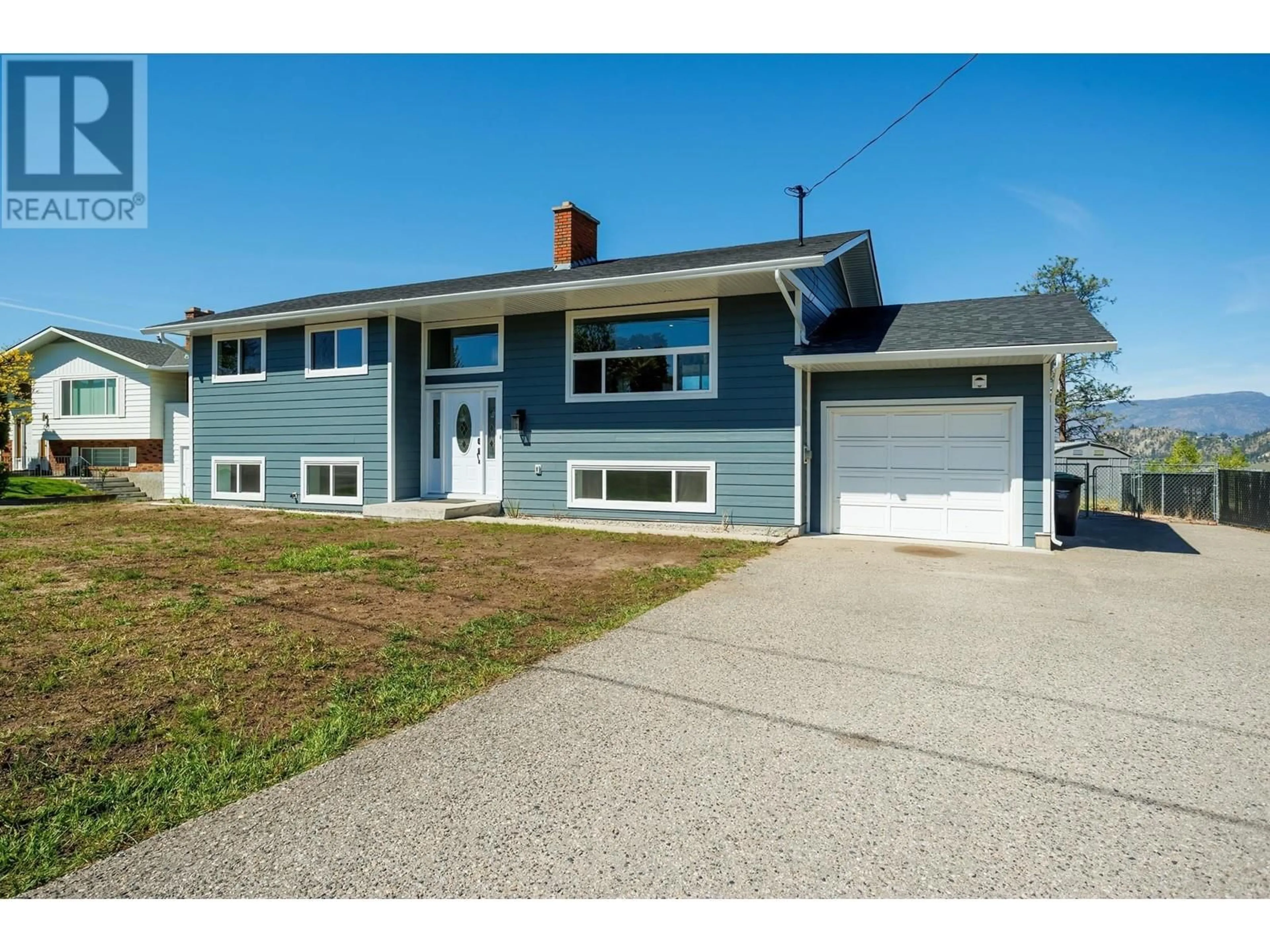 Home with vinyl exterior material, street for 780 DOUGALL ROAD, Kelowna British Columbia V1X3J8