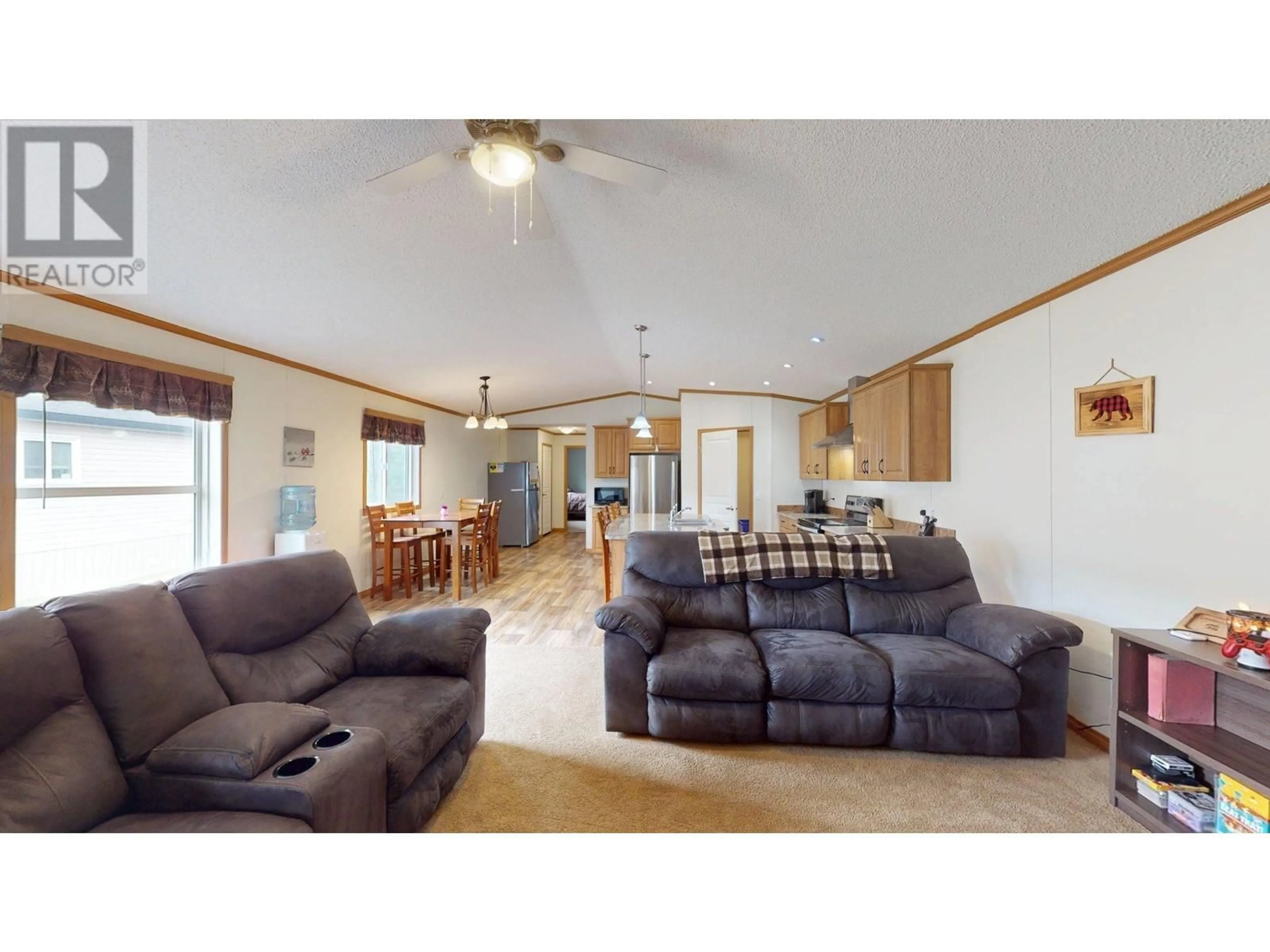 Living room with furniture, wood/laminate floor for 37 WILDERNESS  HEIGHTS WAY, Elkford British Columbia V0B1H0
