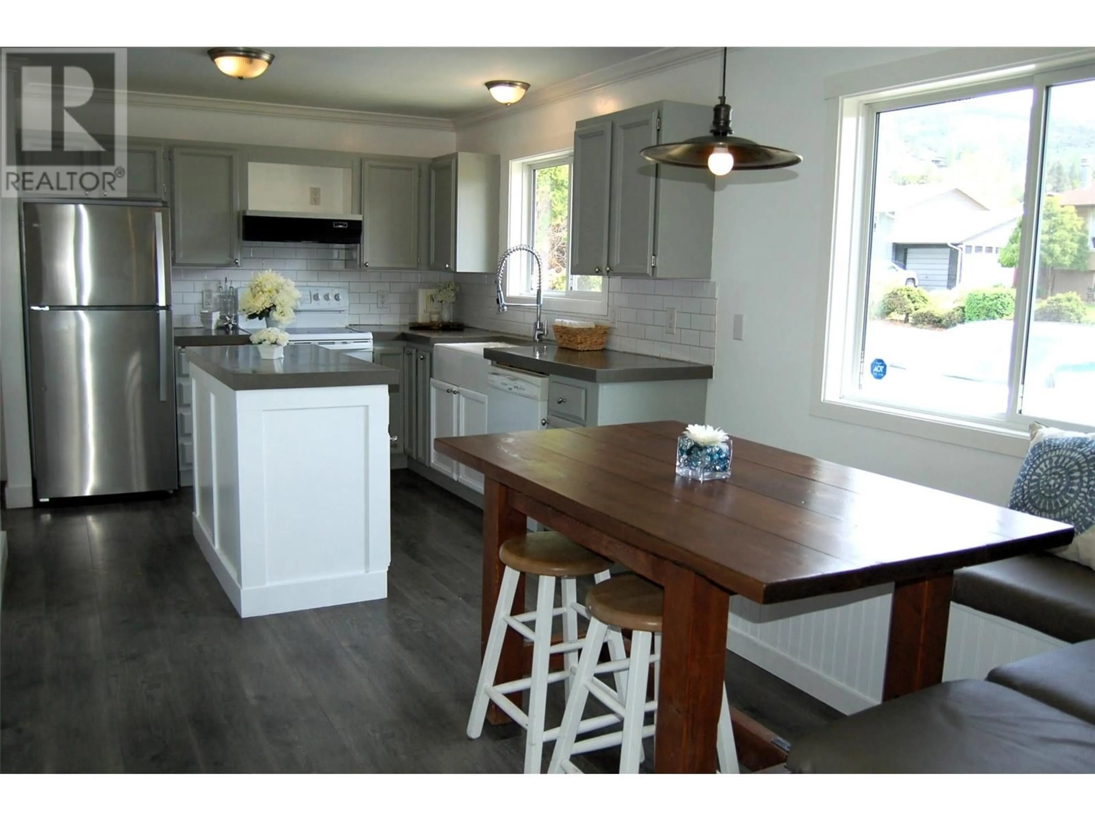 Open concept kitchen, wood/laminate floor for 103 CLELAND DRIVE, Penticton British Columbia V2A7H4