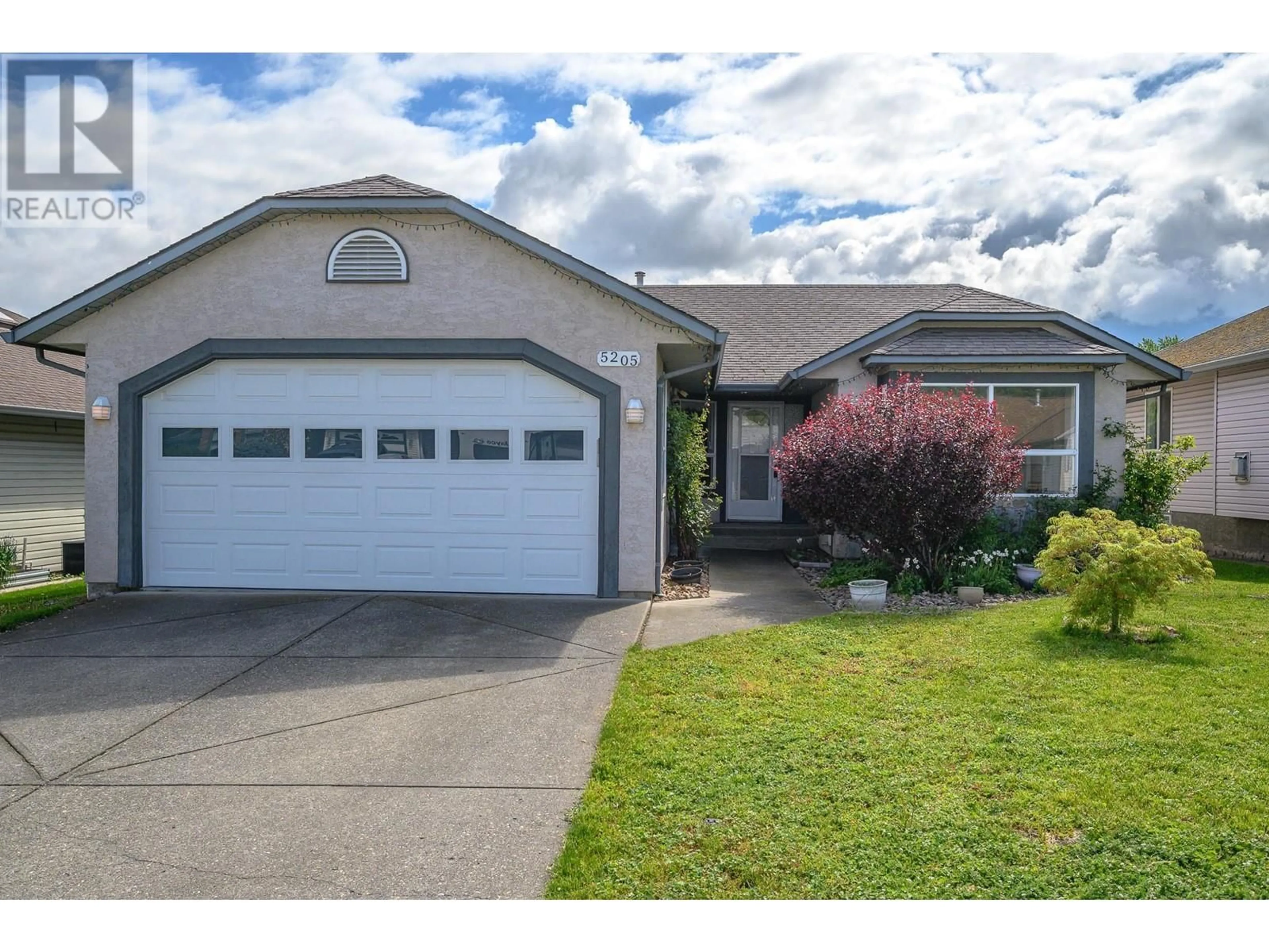 Home with vinyl exterior material, street for 5205 21 STREET, Vernon British Columbia V1T9N2
