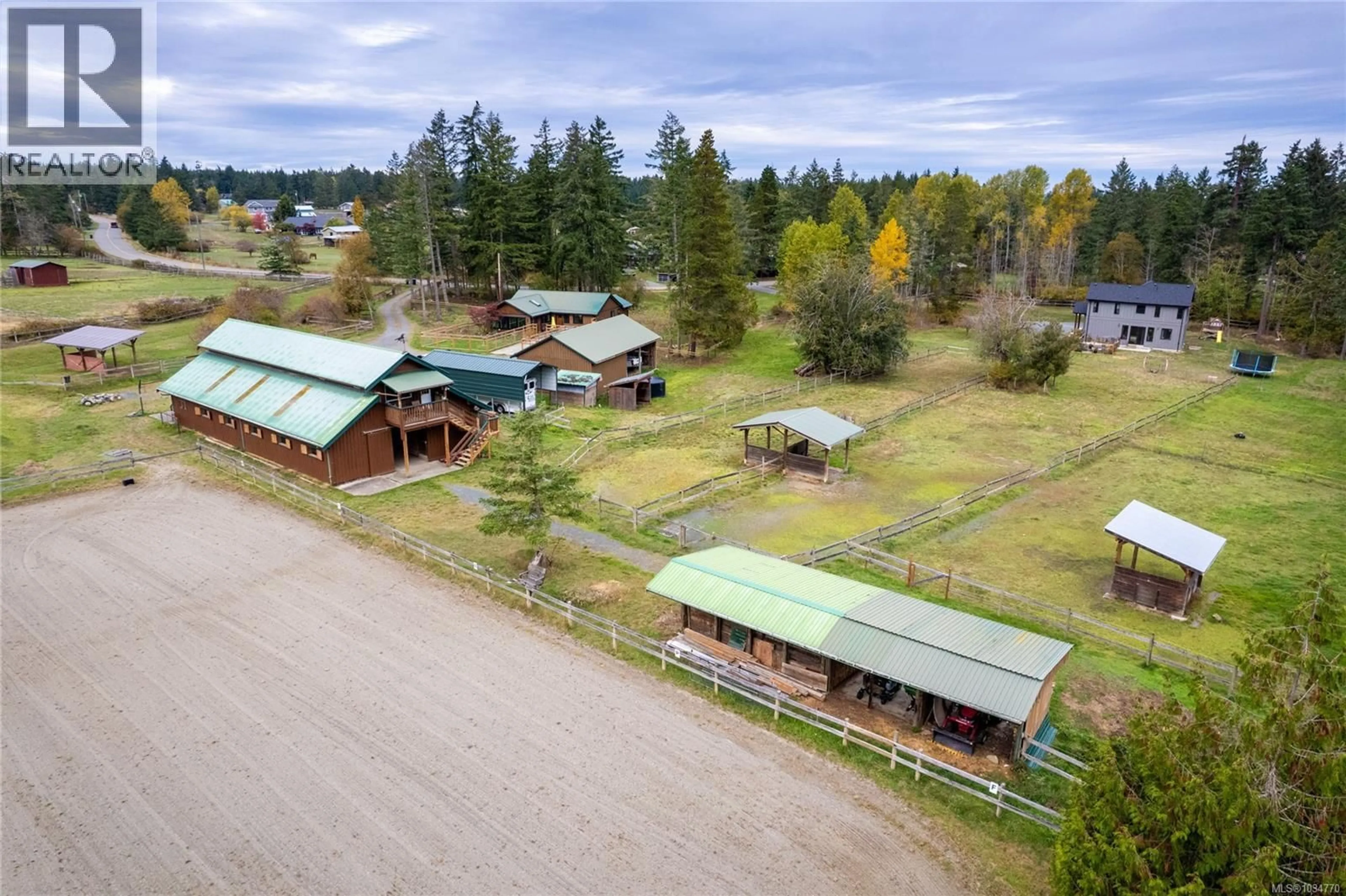 A pic from outside/outdoor area/front of a property/back of a property/a pic from drone, mountain view for 2040 SADDLE DRIVE, Nanoose Bay British Columbia V9P9C2