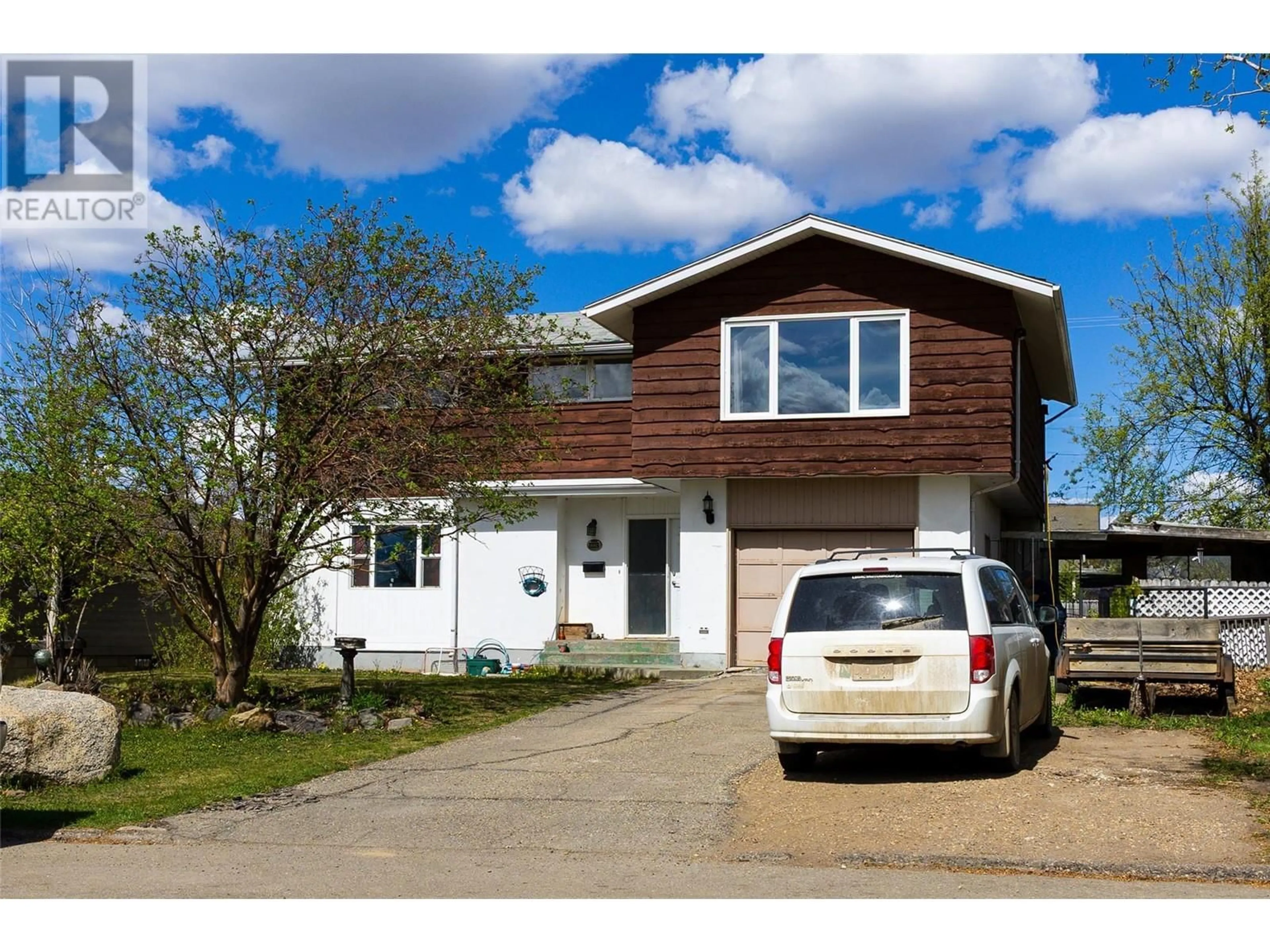 Home with vinyl exterior material, street for 1924 90 AVENUE, Dawson Creek British Columbia V1G1A6