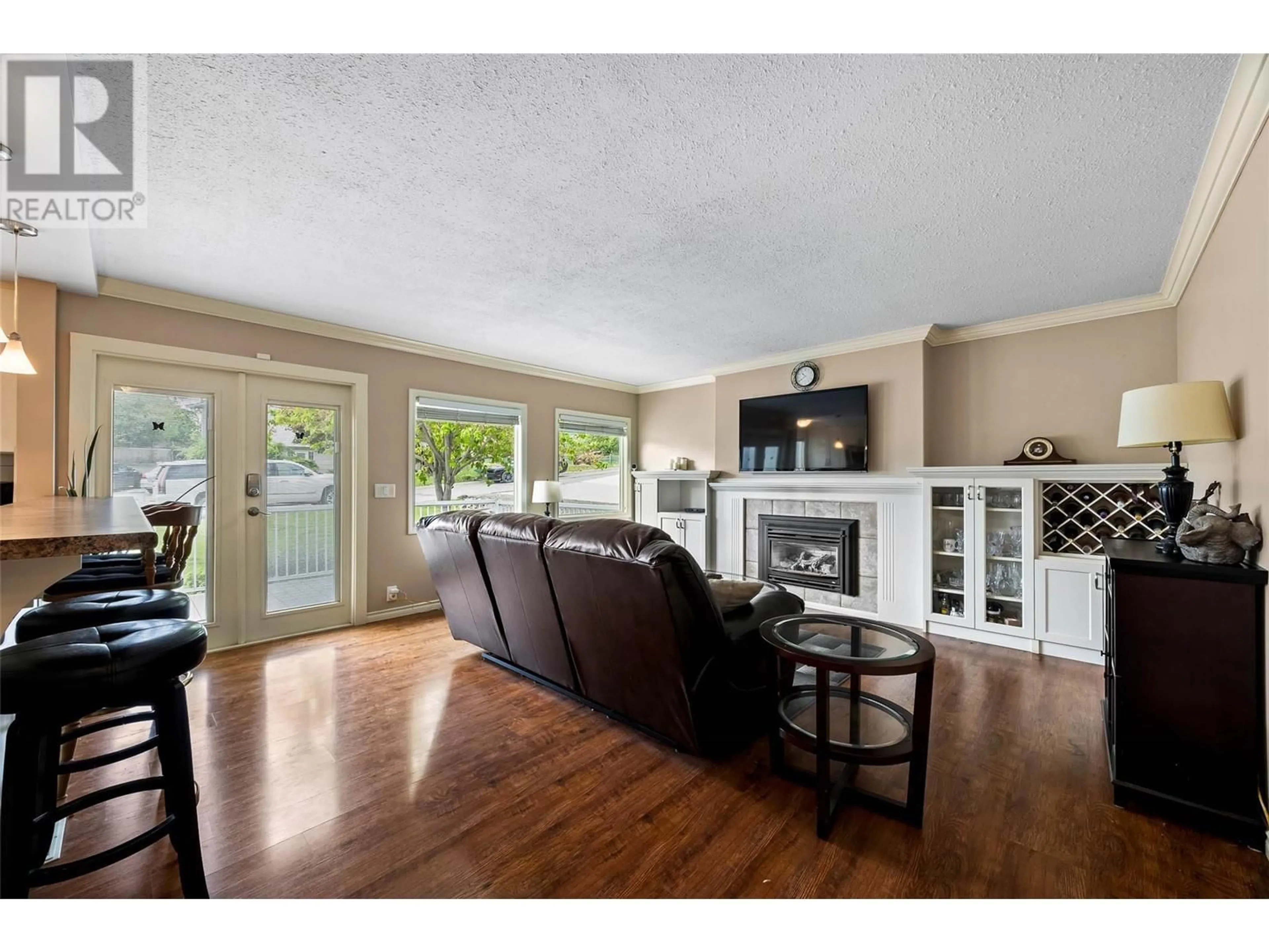 Living room with furniture, wood/laminate floor for 840 AGASSIZ ROAD, Kamloops British Columbia V2B6G8