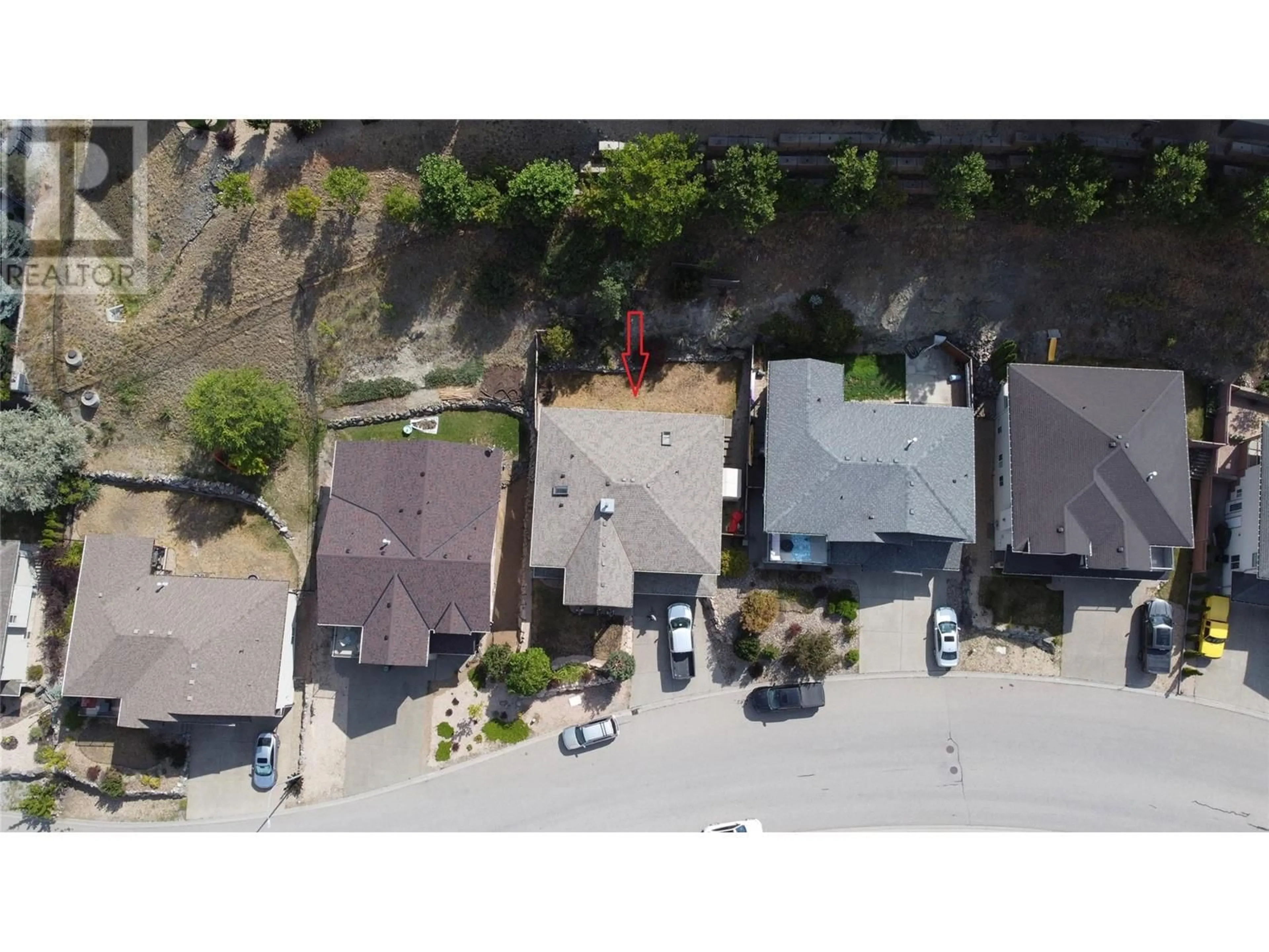 A pic from outside/outdoor area/front of a property/back of a property/a pic from drone, street for 1047 MT IDA DRIVE, Vernon British Columbia V1B4A7