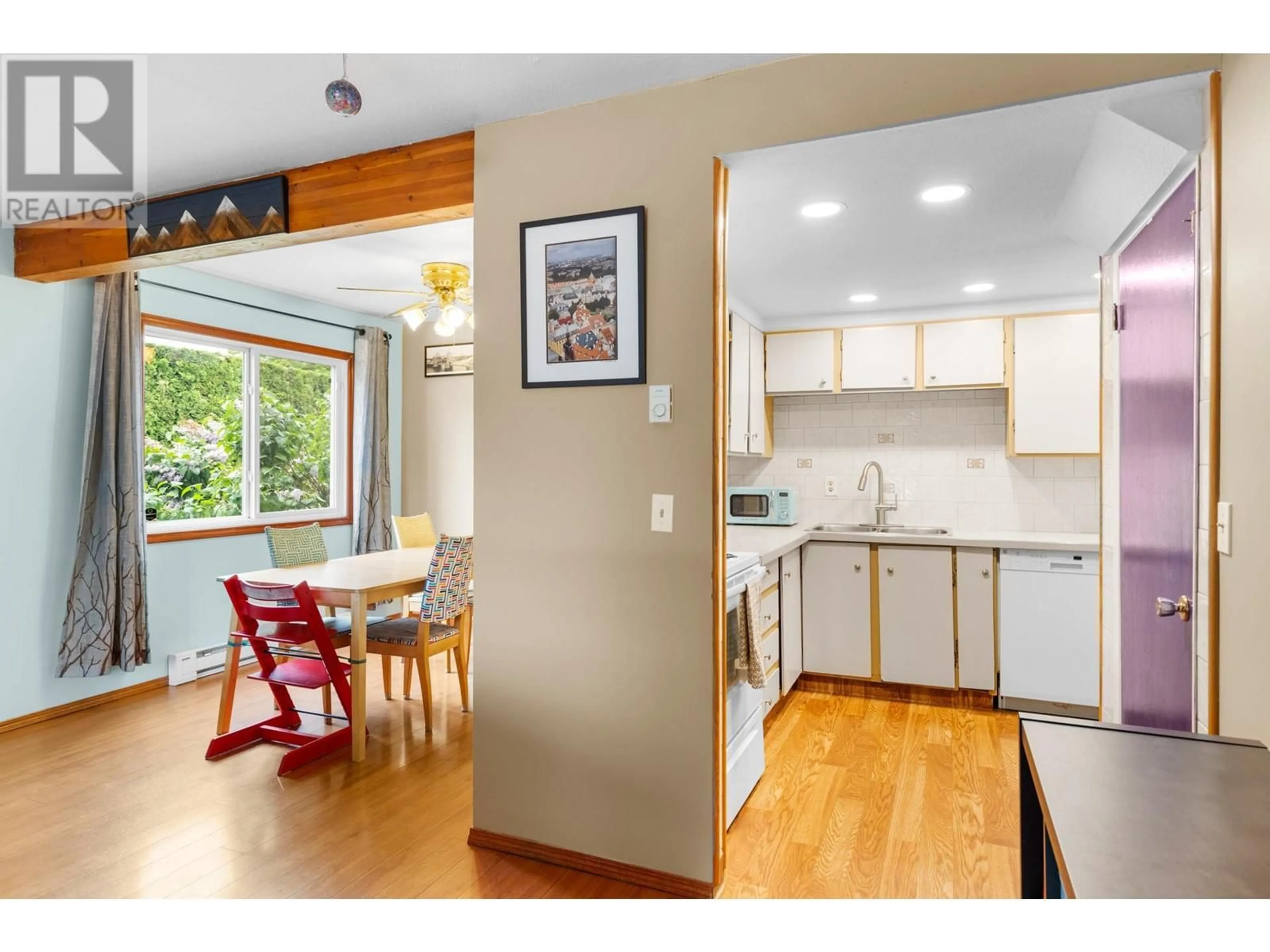 Open concept kitchen, wood/laminate floor for 9 - 1471 INKAR ROAD, Kelowna British Columbia V1Y8J1