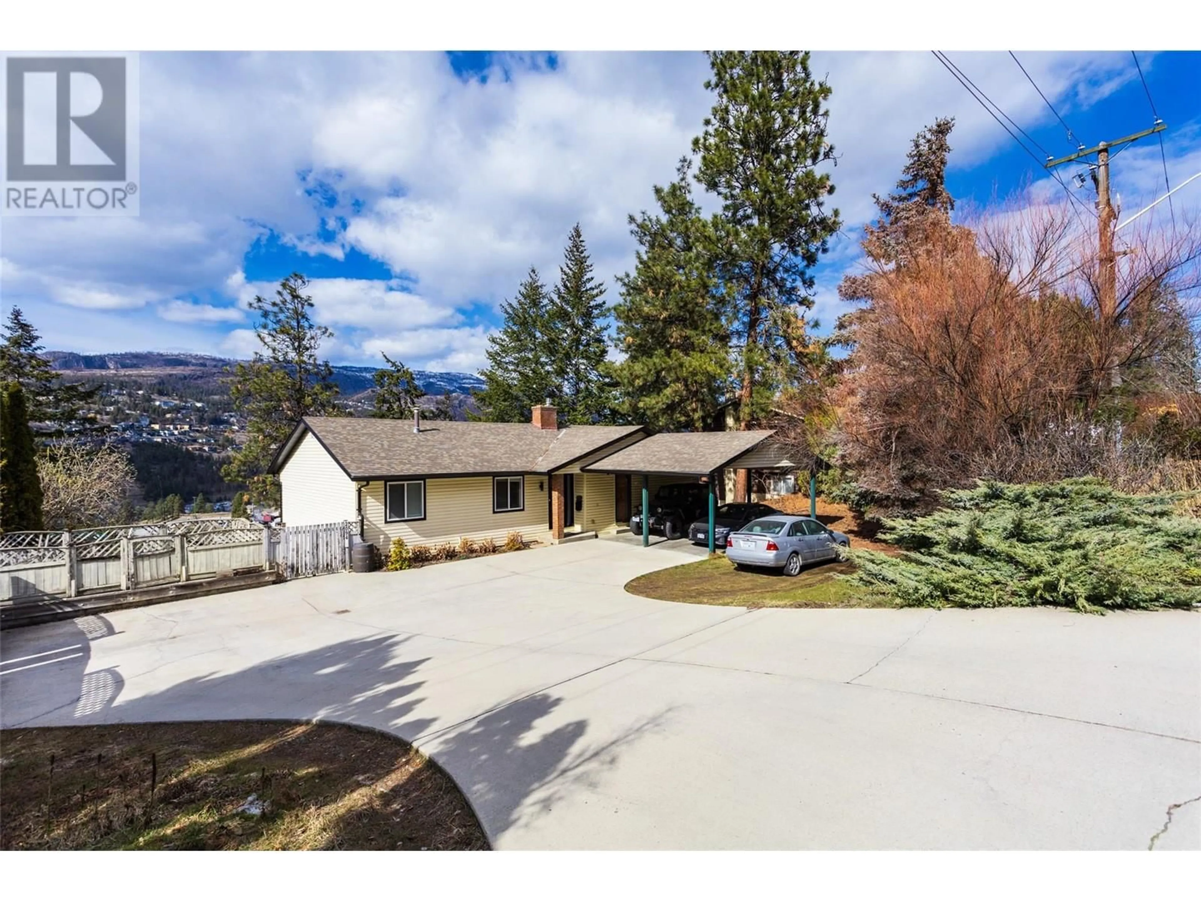 A pic from outside/outdoor area/front of a property/back of a property/a pic from drone, mountain view for 2094 TOMAT AVENUE, Kelowna British Columbia V1Z3J2