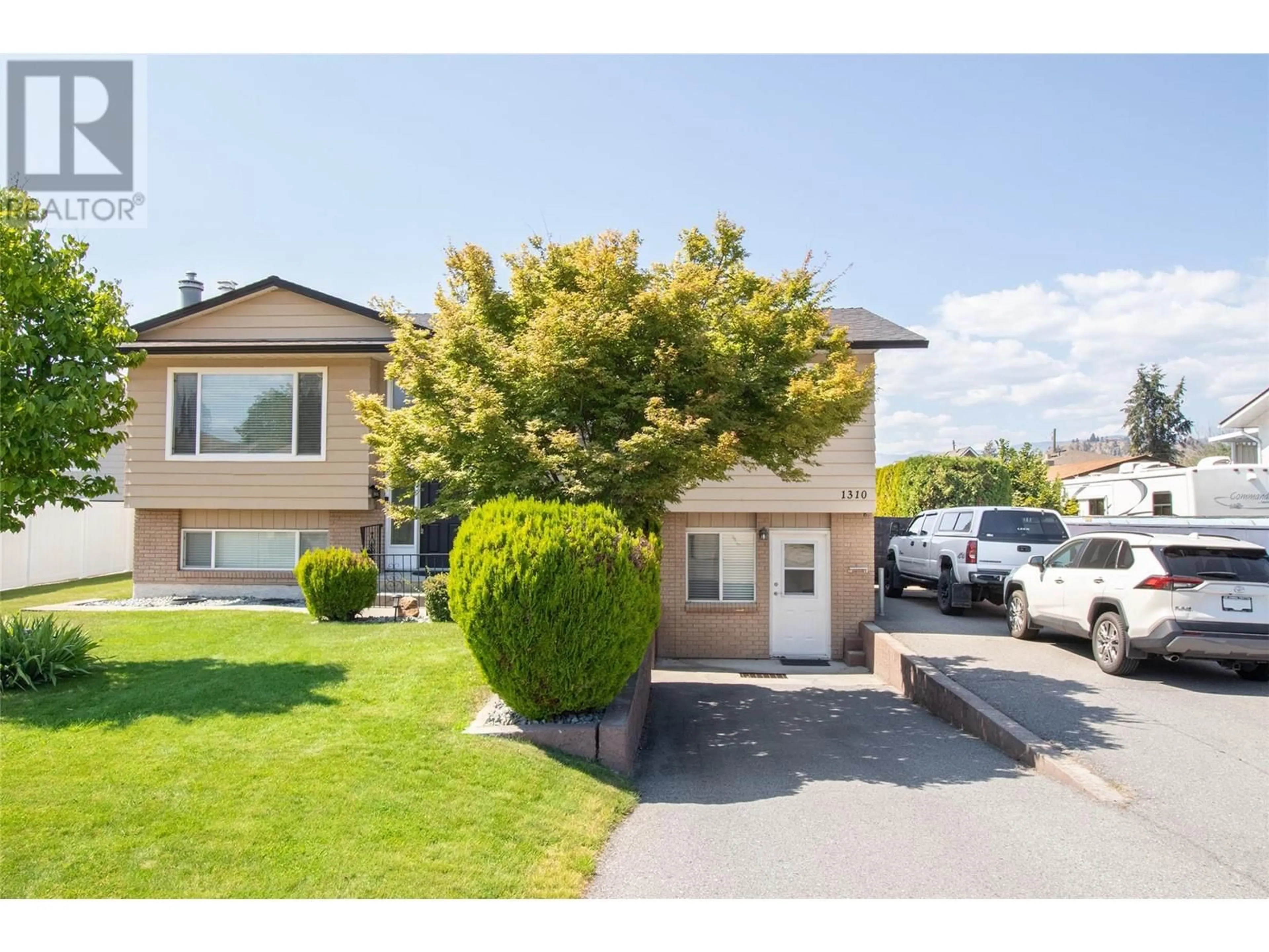 Home with vinyl exterior material, street for 1310 MARY COURT, Kelowna British Columbia V1X5V3