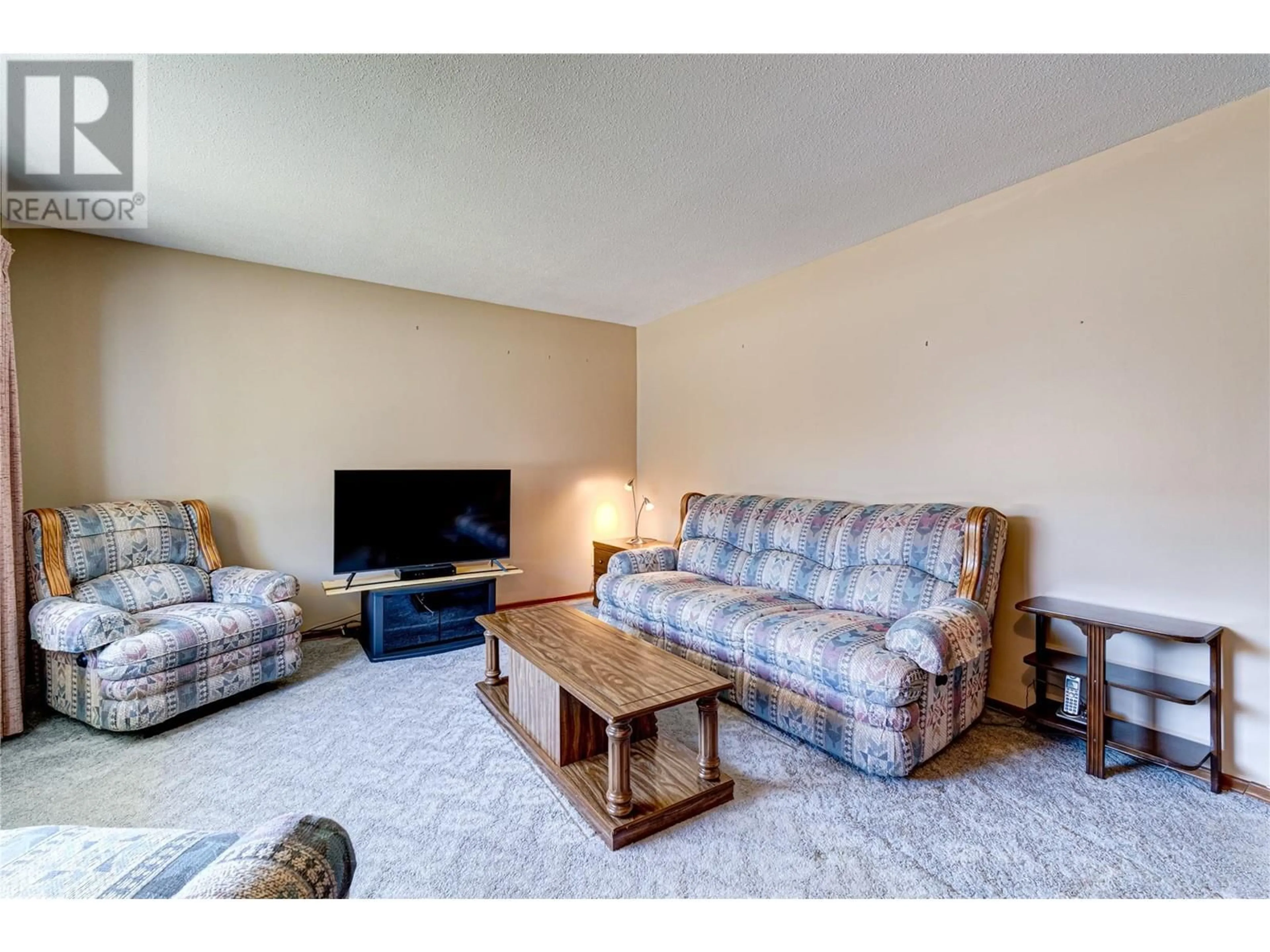 Living room with furniture, carpet floor for 312 ALPINE PLACE, Sparwood British Columbia V0B2G0