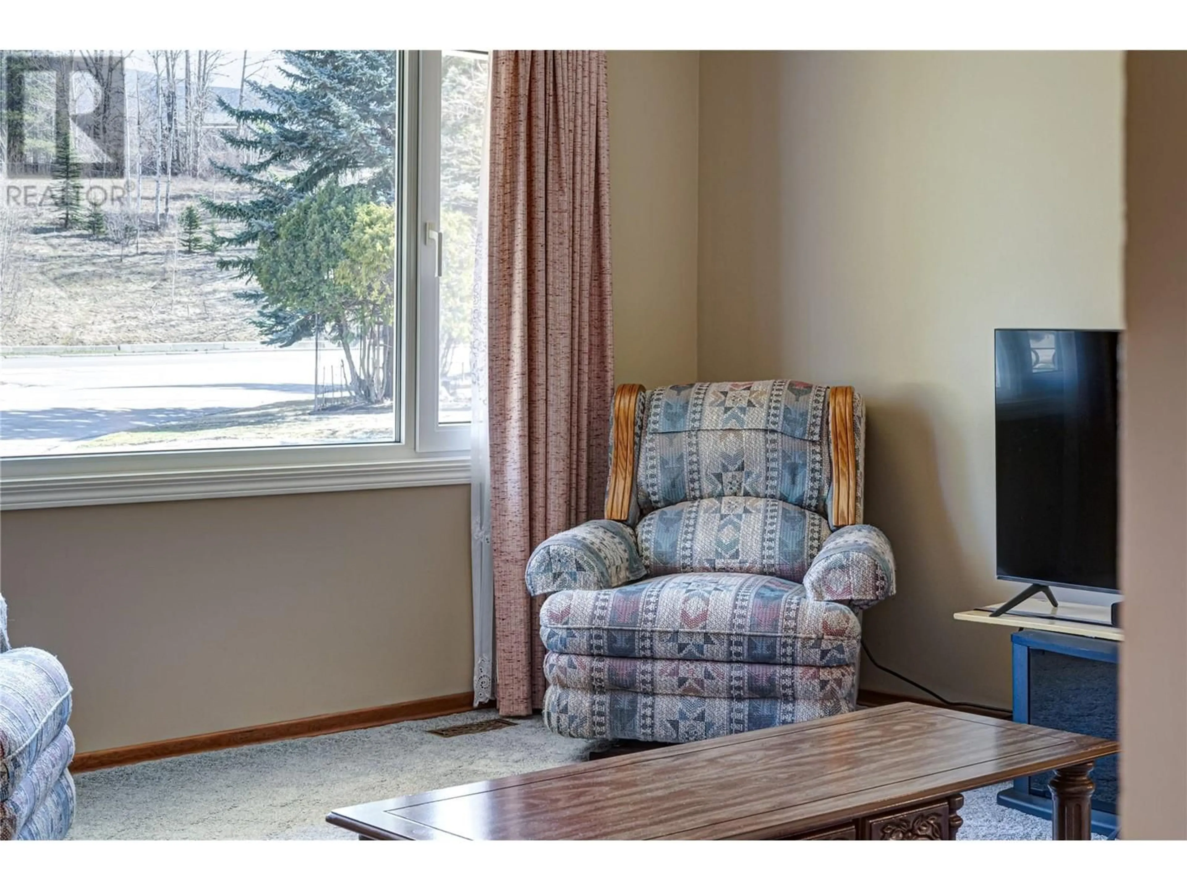 Living room with furniture, wood/laminate floor for 312 ALPINE PLACE, Sparwood British Columbia V0B2G0