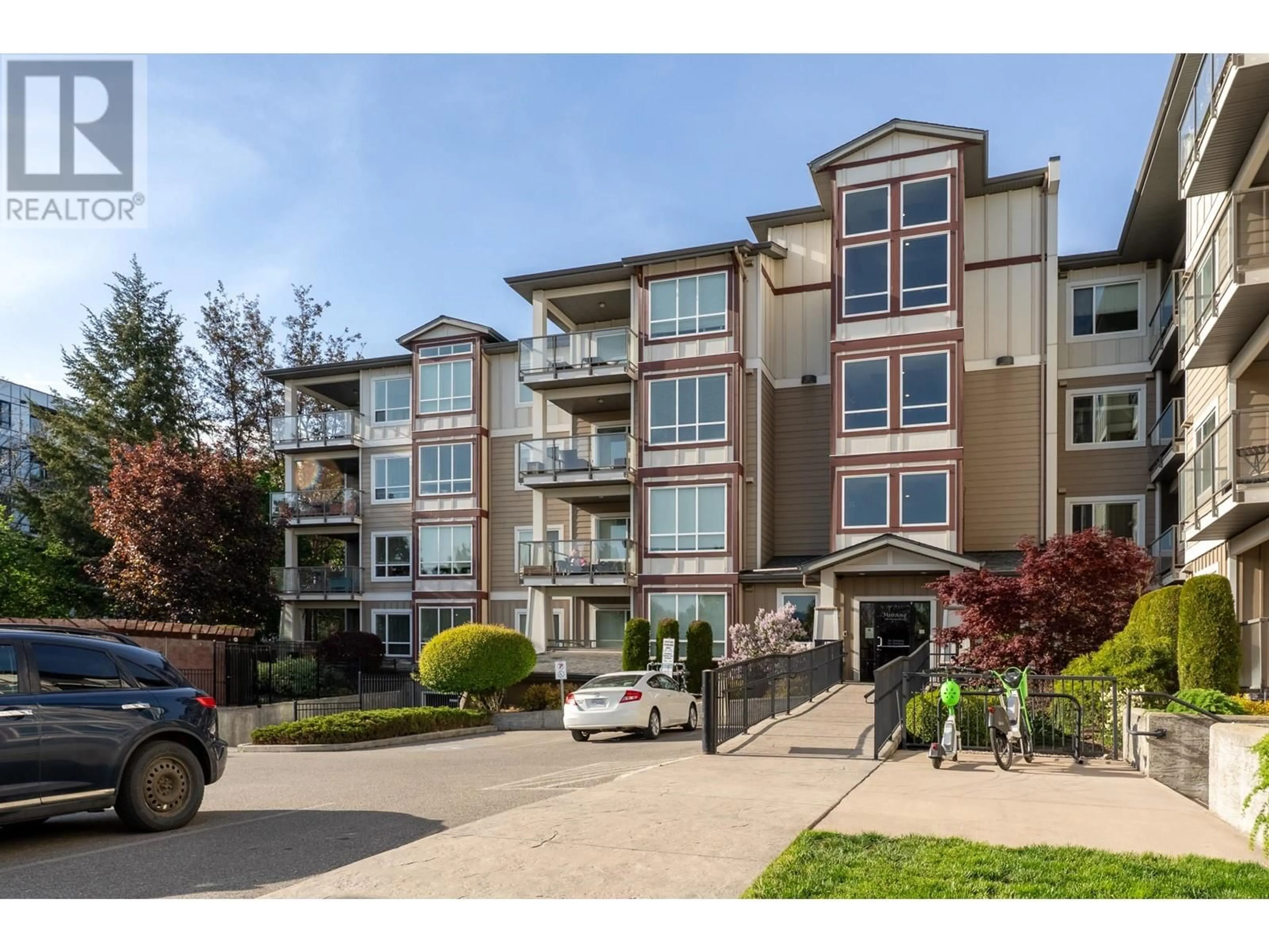 A pic from outside/outdoor area/front of a property/back of a property/a pic from drone, street for 121 - 850 SAUCIER AVENUE, Kelowna British Columbia V5N1T7