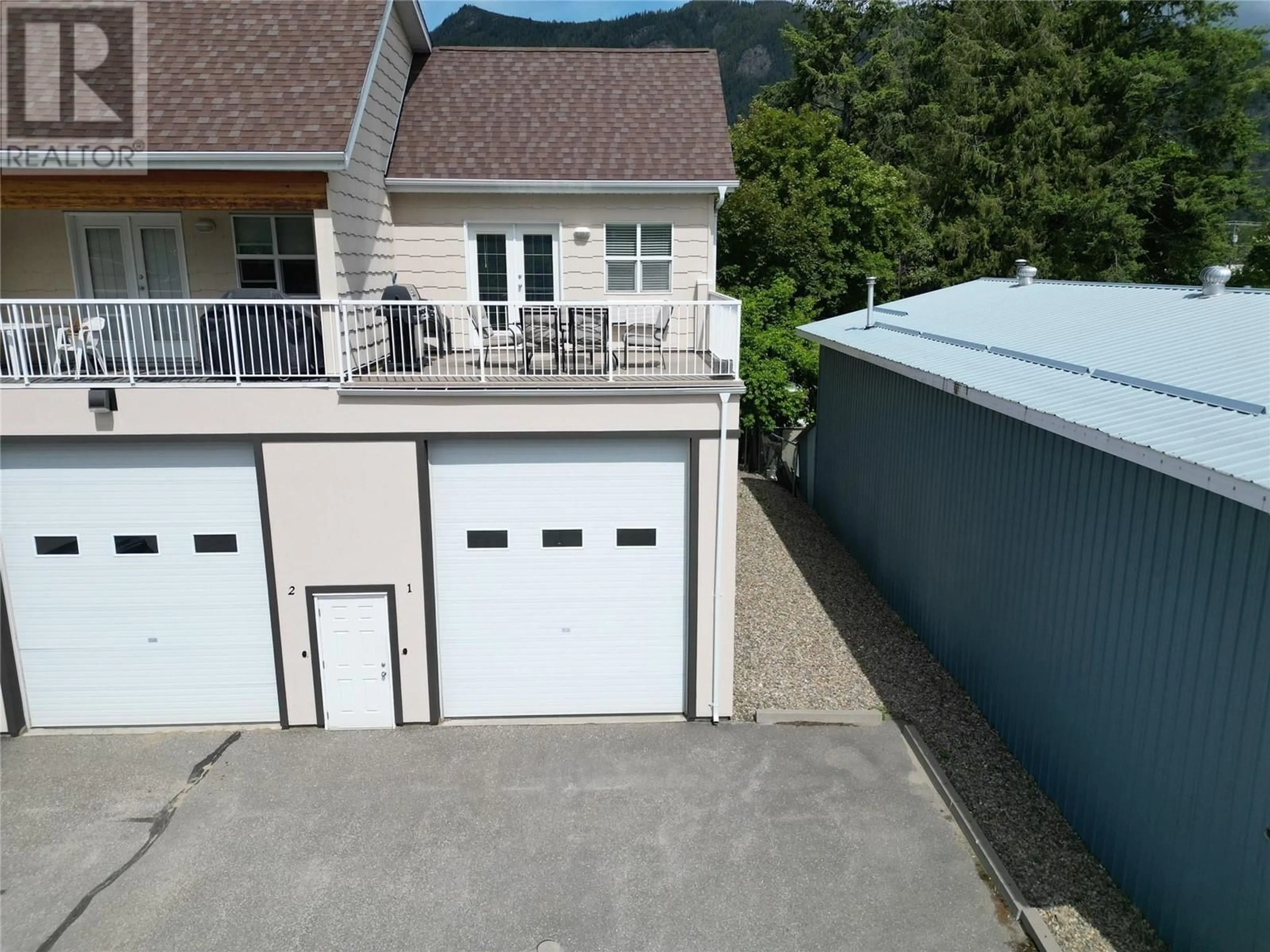 A pic from outside/outdoor area/front of a property/back of a property/a pic from drone, unknown for 1 - 1205 RIVERSIDE AVENUE, Sicamous British Columbia V0E2V1