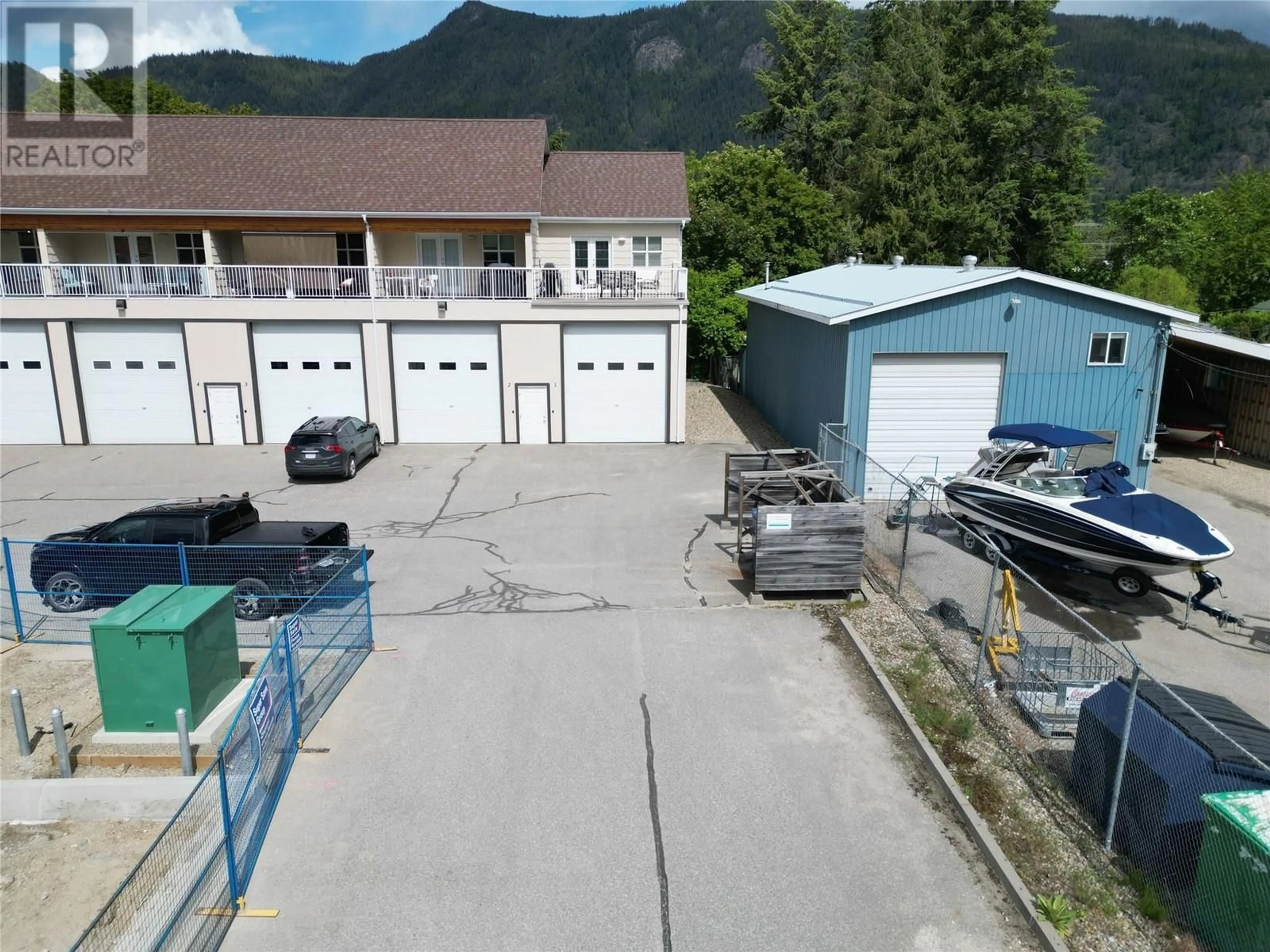 A pic from outside/outdoor area/front of a property/back of a property/a pic from drone, mountain view for 1 - 1205 RIVERSIDE AVENUE, Sicamous British Columbia V0E2V1
