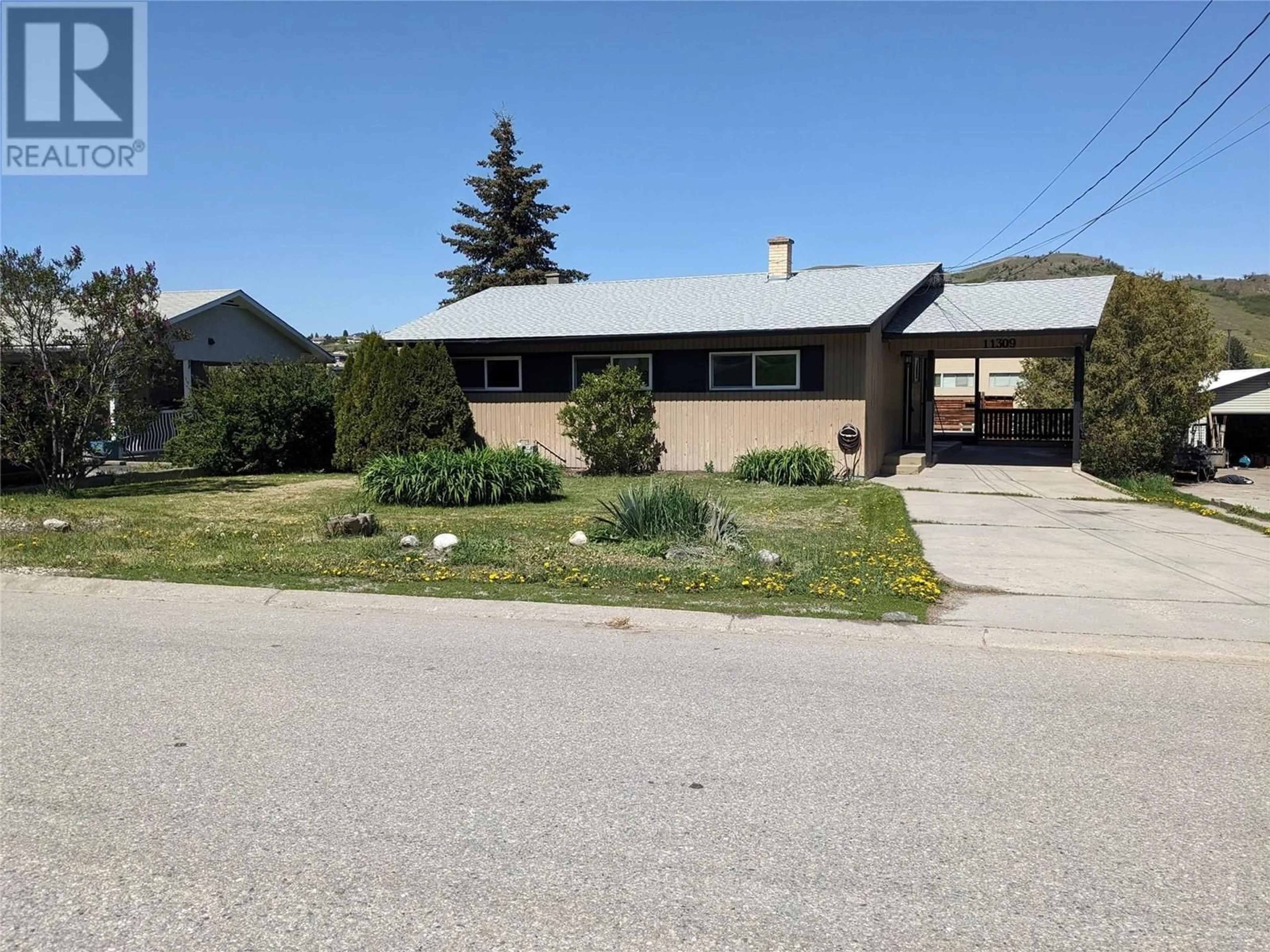 Home with vinyl exterior material, street for 11309 TASSIE DRIVE, Coldstream British Columbia V1B1H3