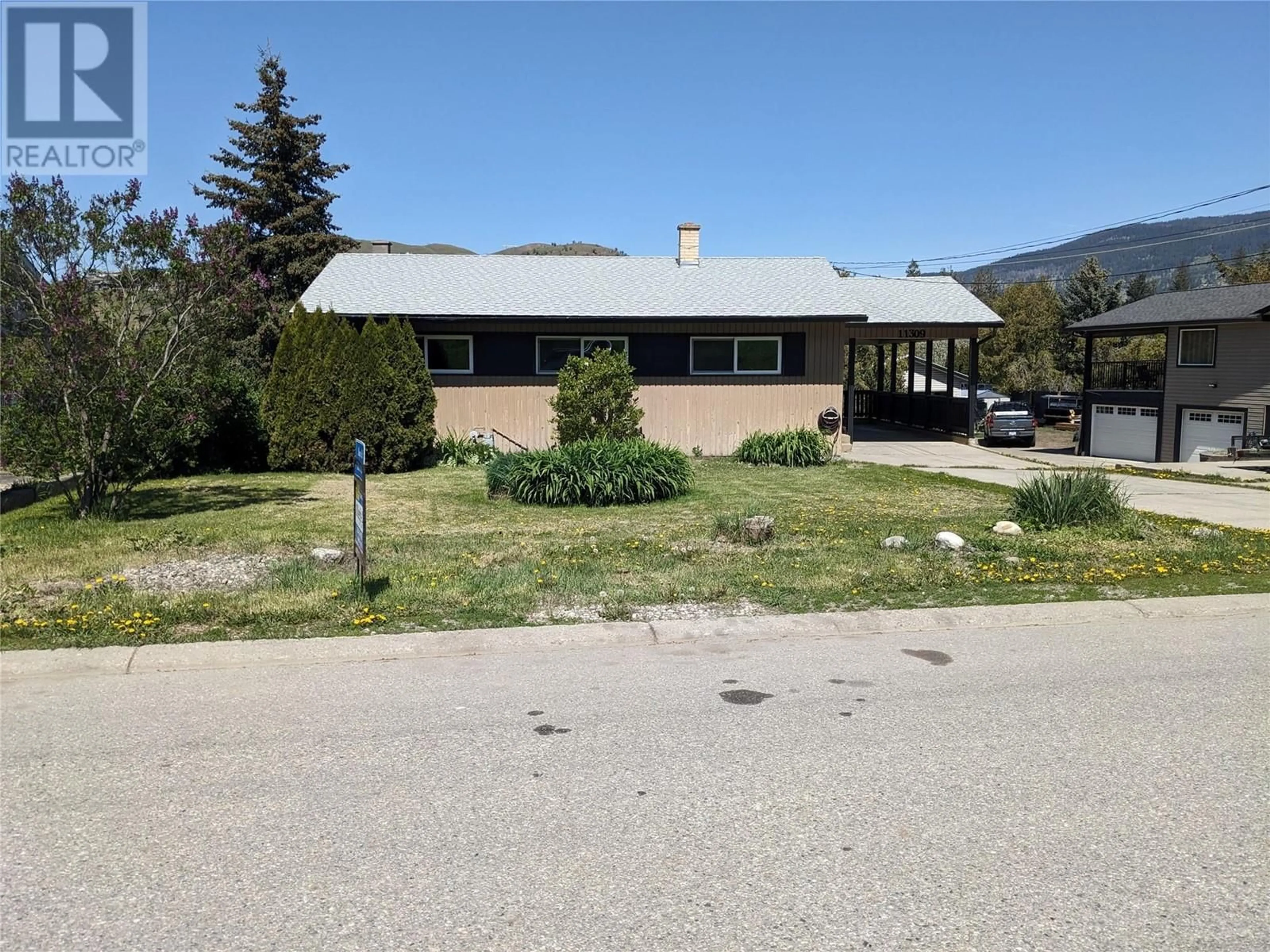 A pic from outside/outdoor area/front of a property/back of a property/a pic from drone, mountain view for 11309 TASSIE DRIVE, Coldstream British Columbia V1B1H3