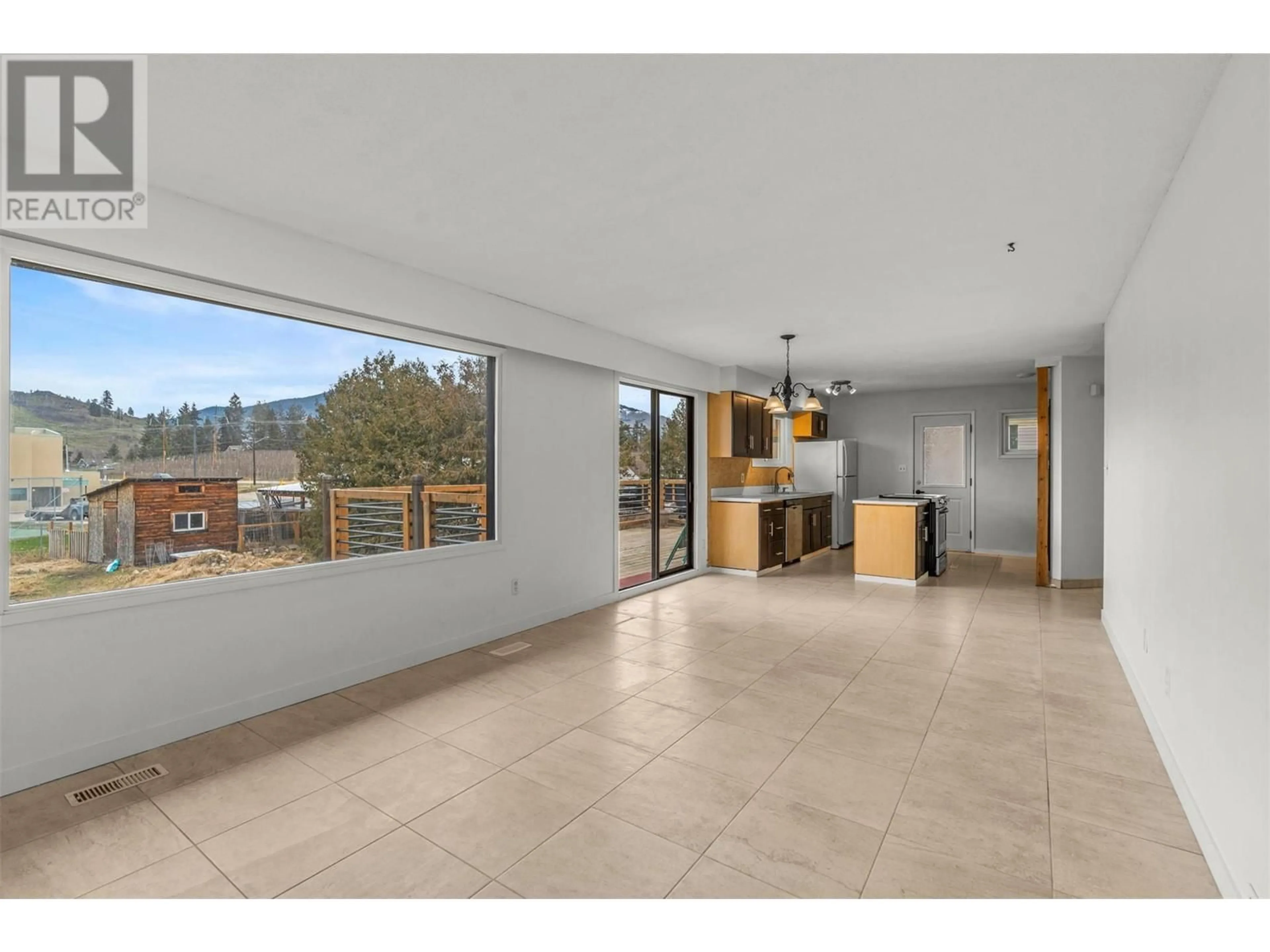 Open concept kitchen, ceramic/tile floor for 11309 TASSIE DRIVE, Coldstream British Columbia V1B1H3