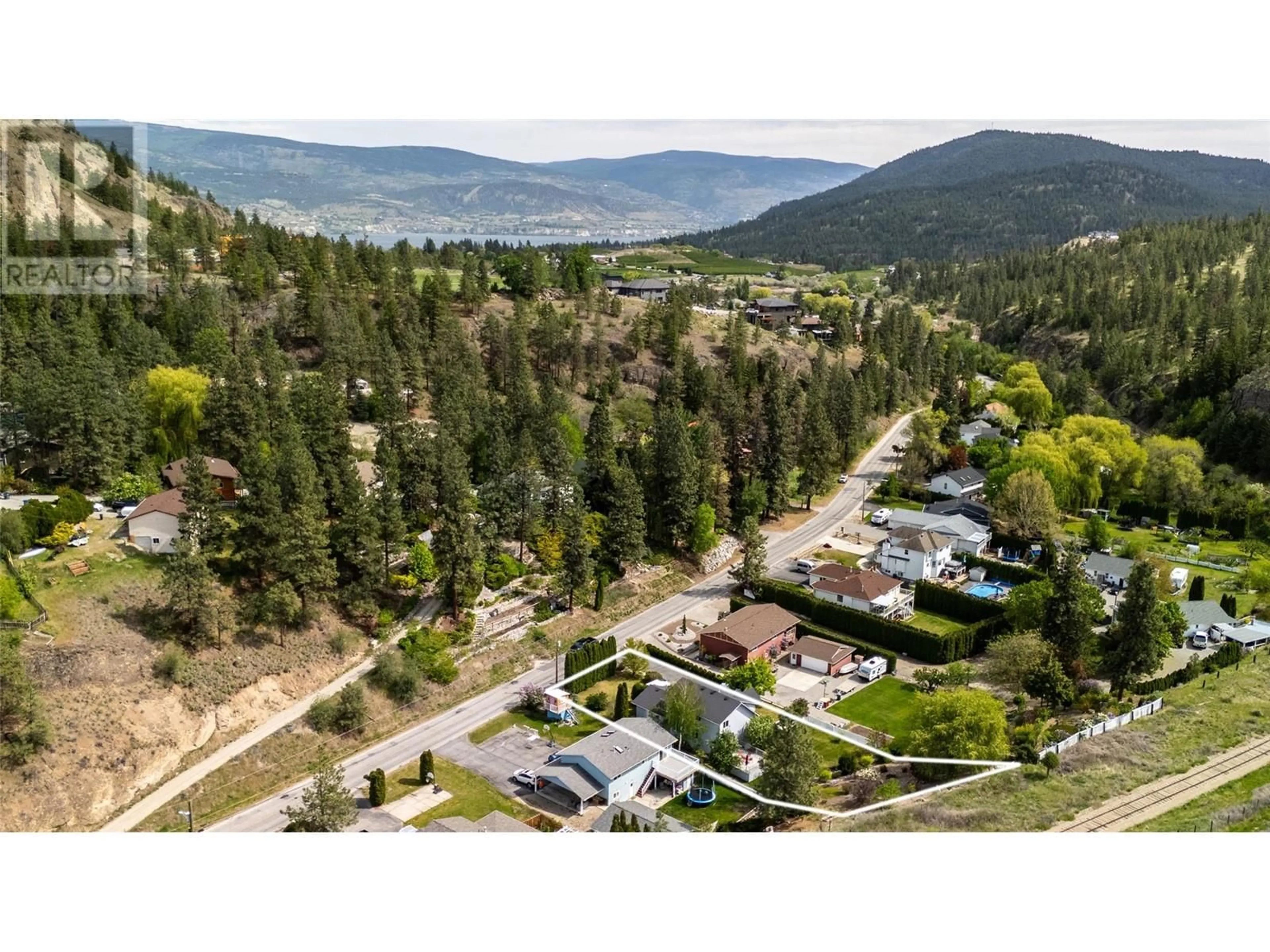 A pic from outside/outdoor area/front of a property/back of a property/a pic from drone, mountain view for 7982 VICTORIA ROAD SOUTH, Summerland British Columbia V0H1Z2