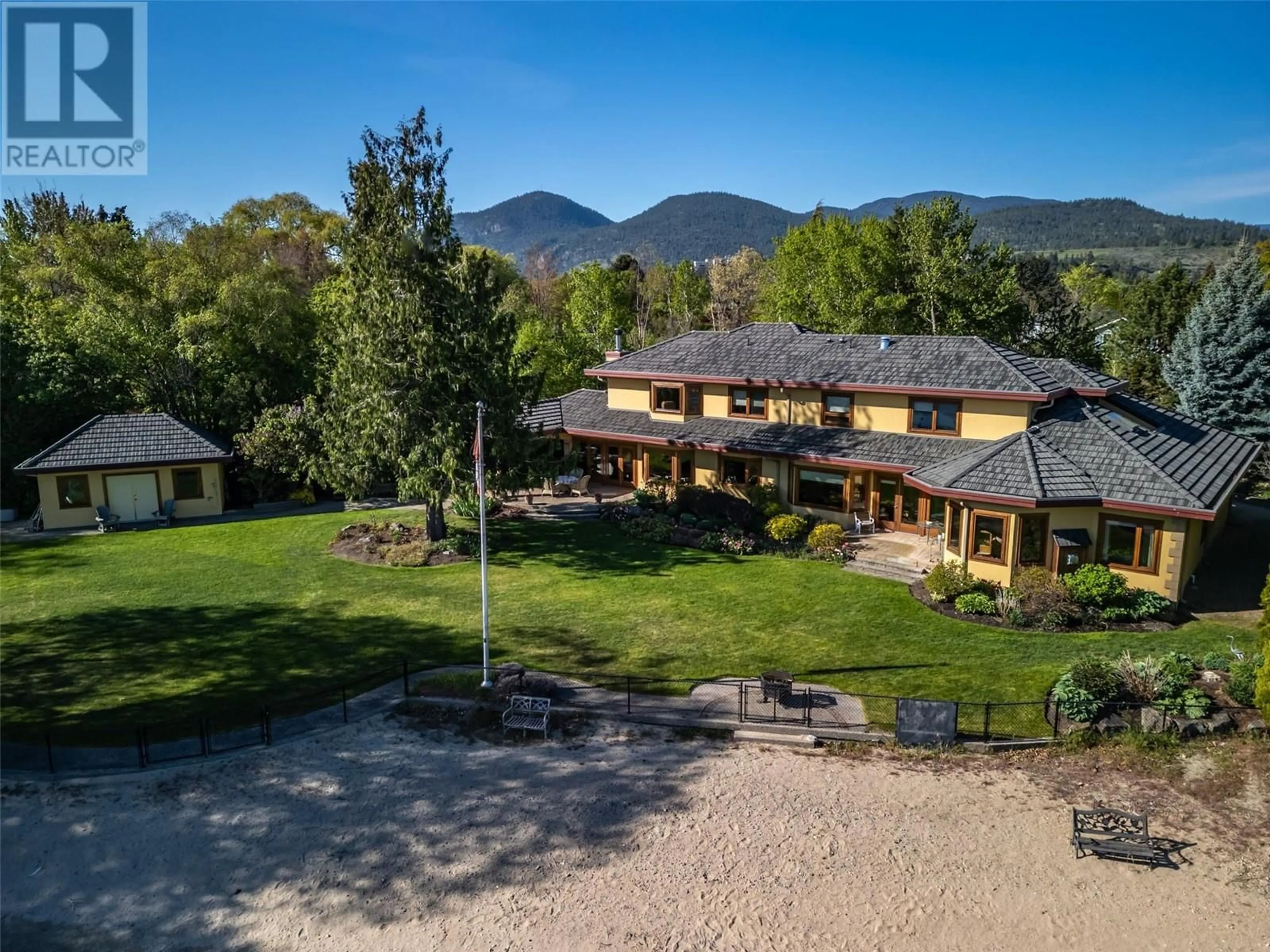 A pic from outside/outdoor area/front of a property/back of a property/a pic from drone, mountain view for 7801 OAK AVENUE, Summerland British Columbia V0H1Z9