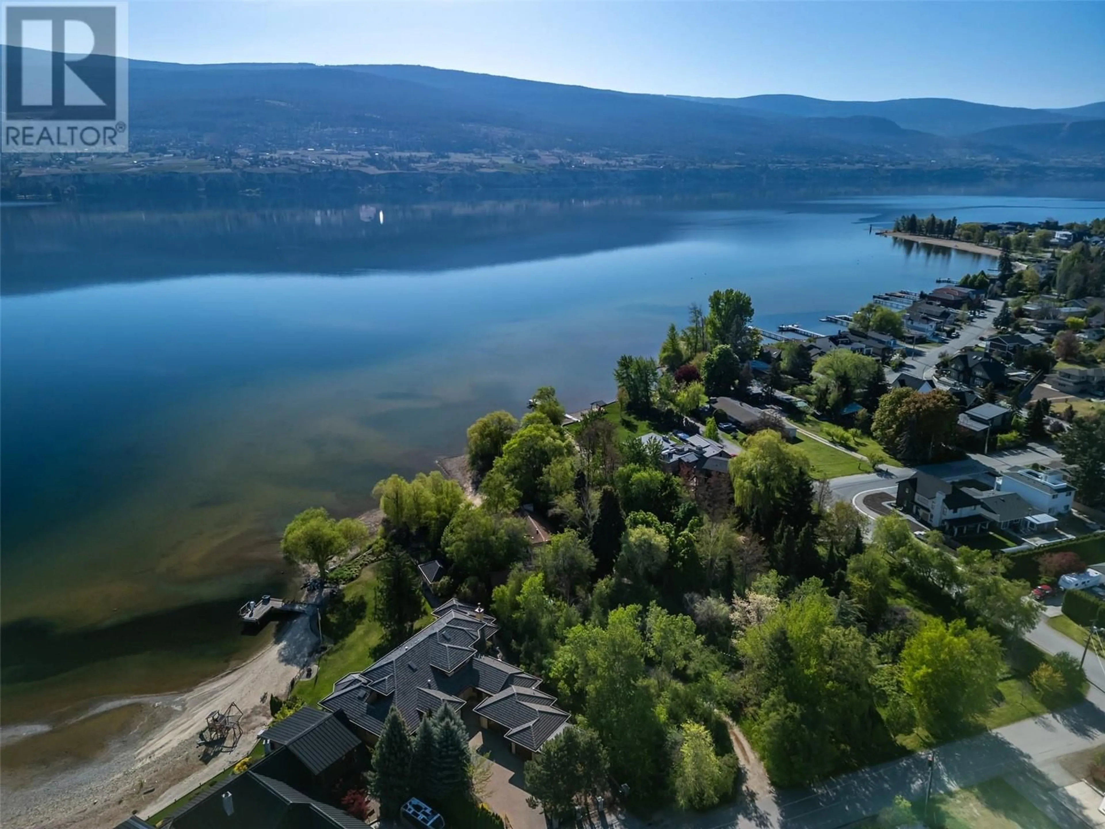 A pic from outside/outdoor area/front of a property/back of a property/a pic from drone, water/lake/river/ocean view for 7801 OAK AVENUE, Summerland British Columbia V0H1Z9