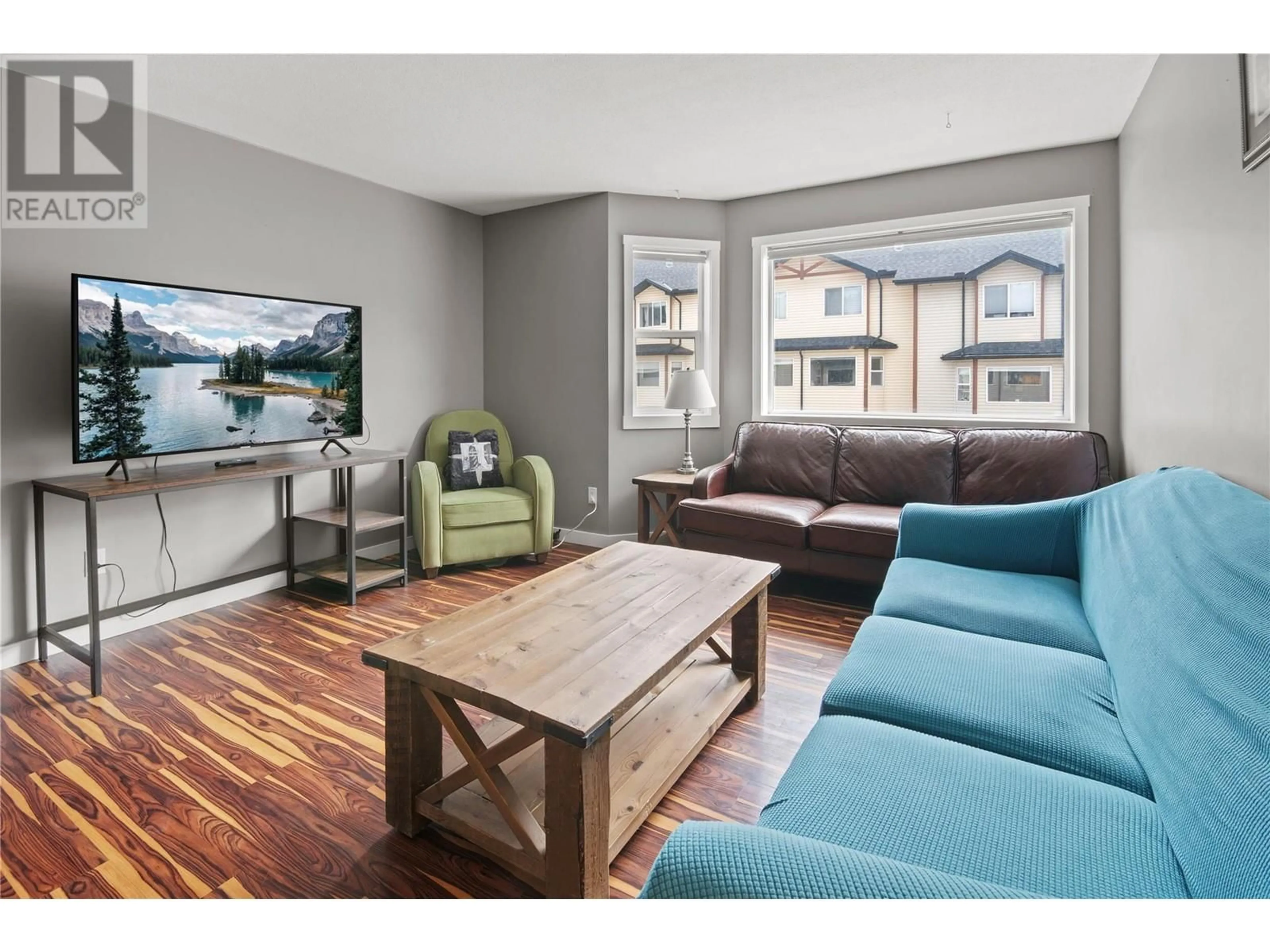 Living room with furniture, wood/laminate floor for 206 - 200 BLACK FOREST TRAIL, Invermere British Columbia V0A1K2