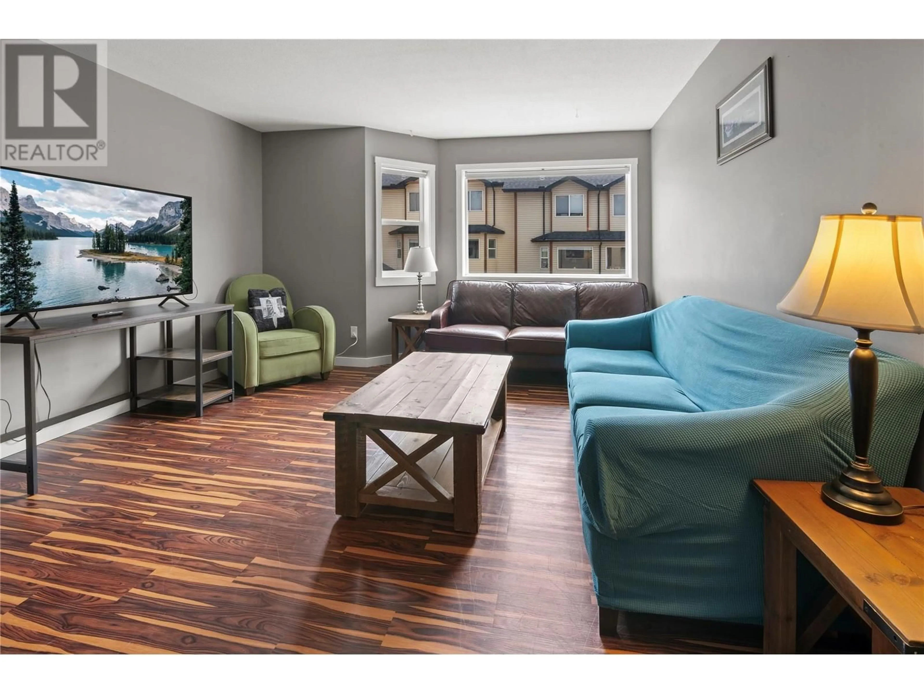 Living room with furniture, wood/laminate floor for 206 - 200 BLACK FOREST TRAIL, Invermere British Columbia V0A1K2