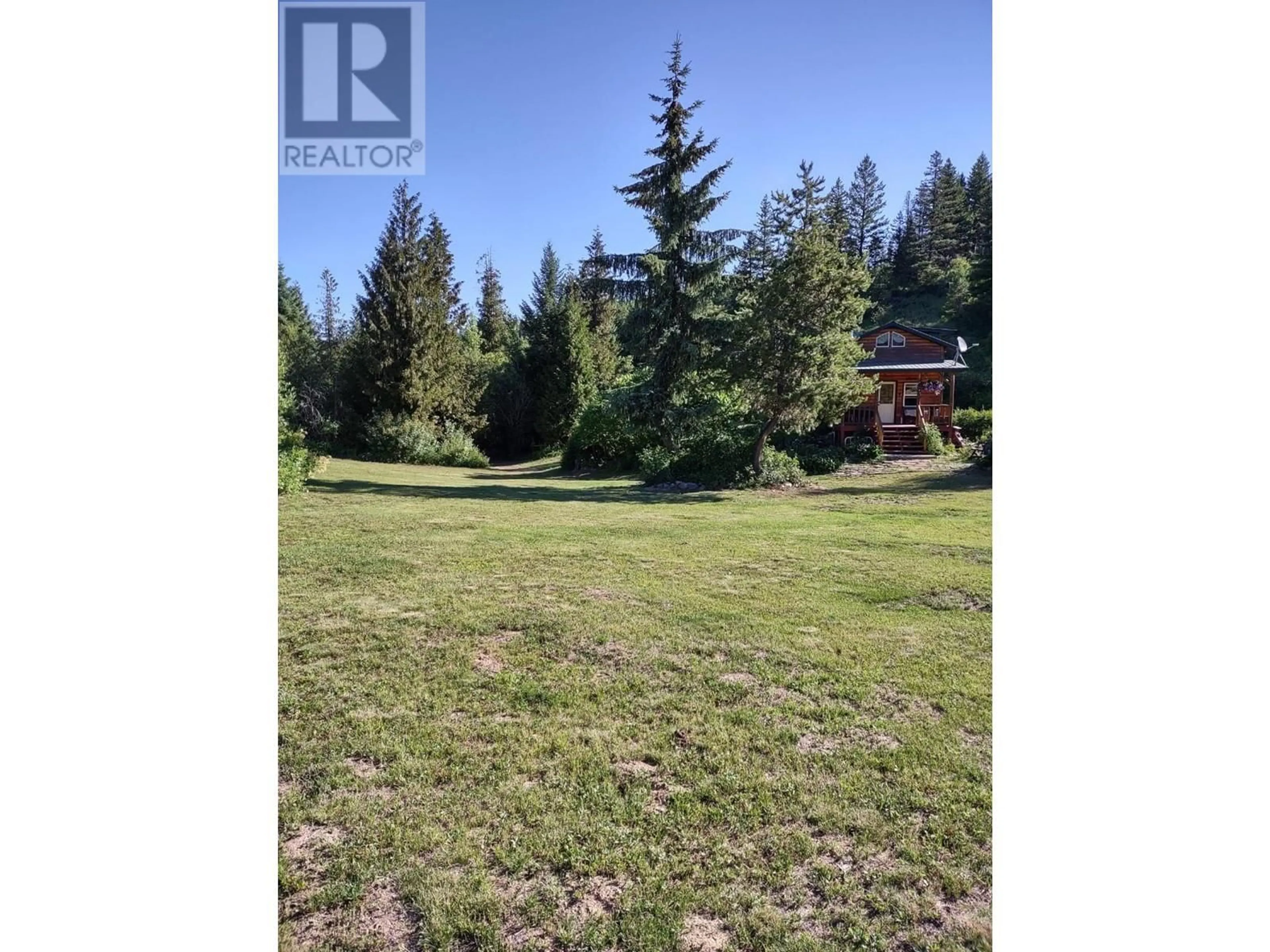 A pic from outside/outdoor area/front of a property/back of a property/a pic from drone, forest/trees view for 9800 3 HIGHWAY, Grand Forks British Columbia V0H1H5