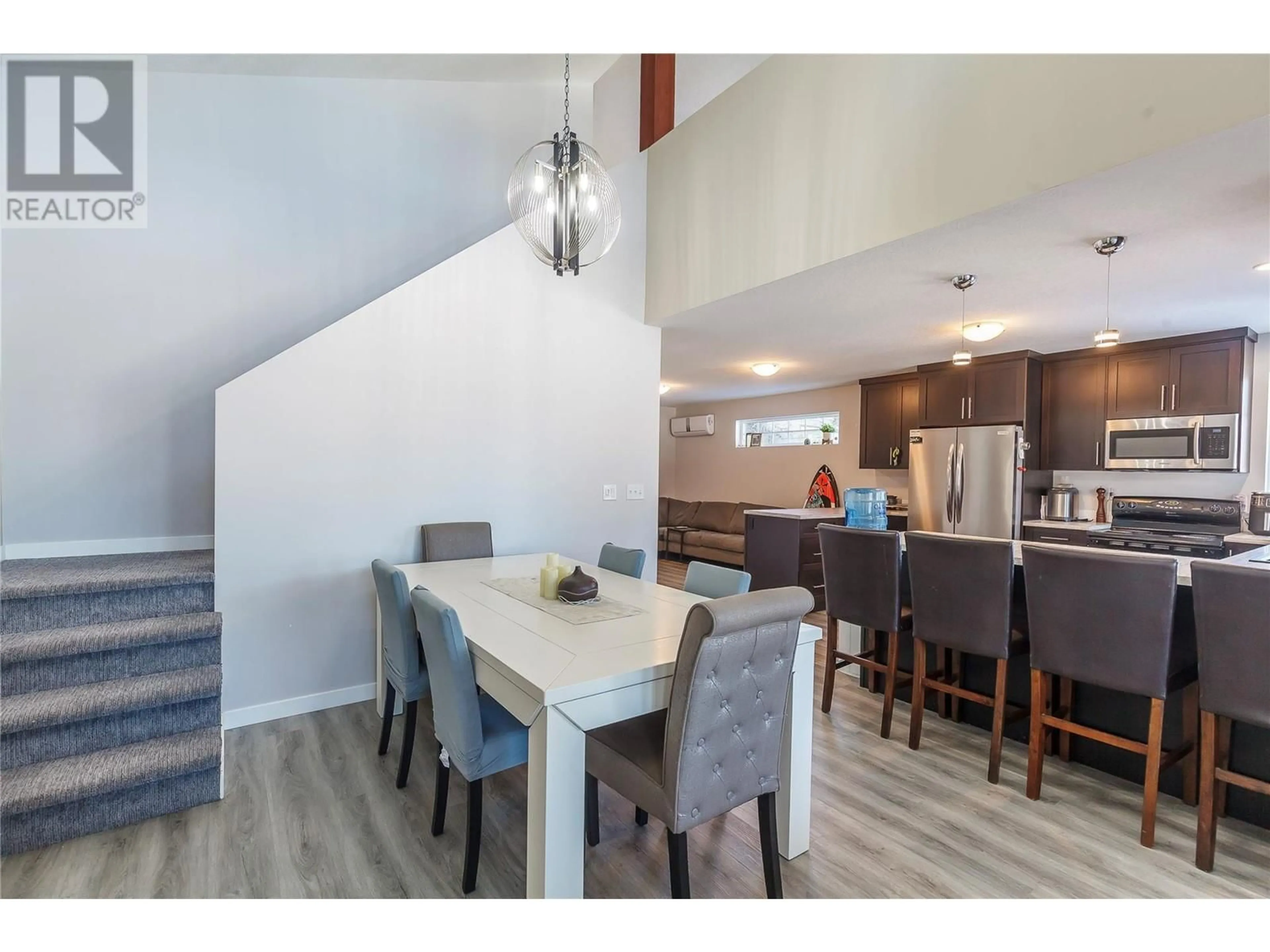 Open concept kitchen, wood/laminate floor for 42 LAKESHORE DRIVE, Vernon British Columbia V1H2A1