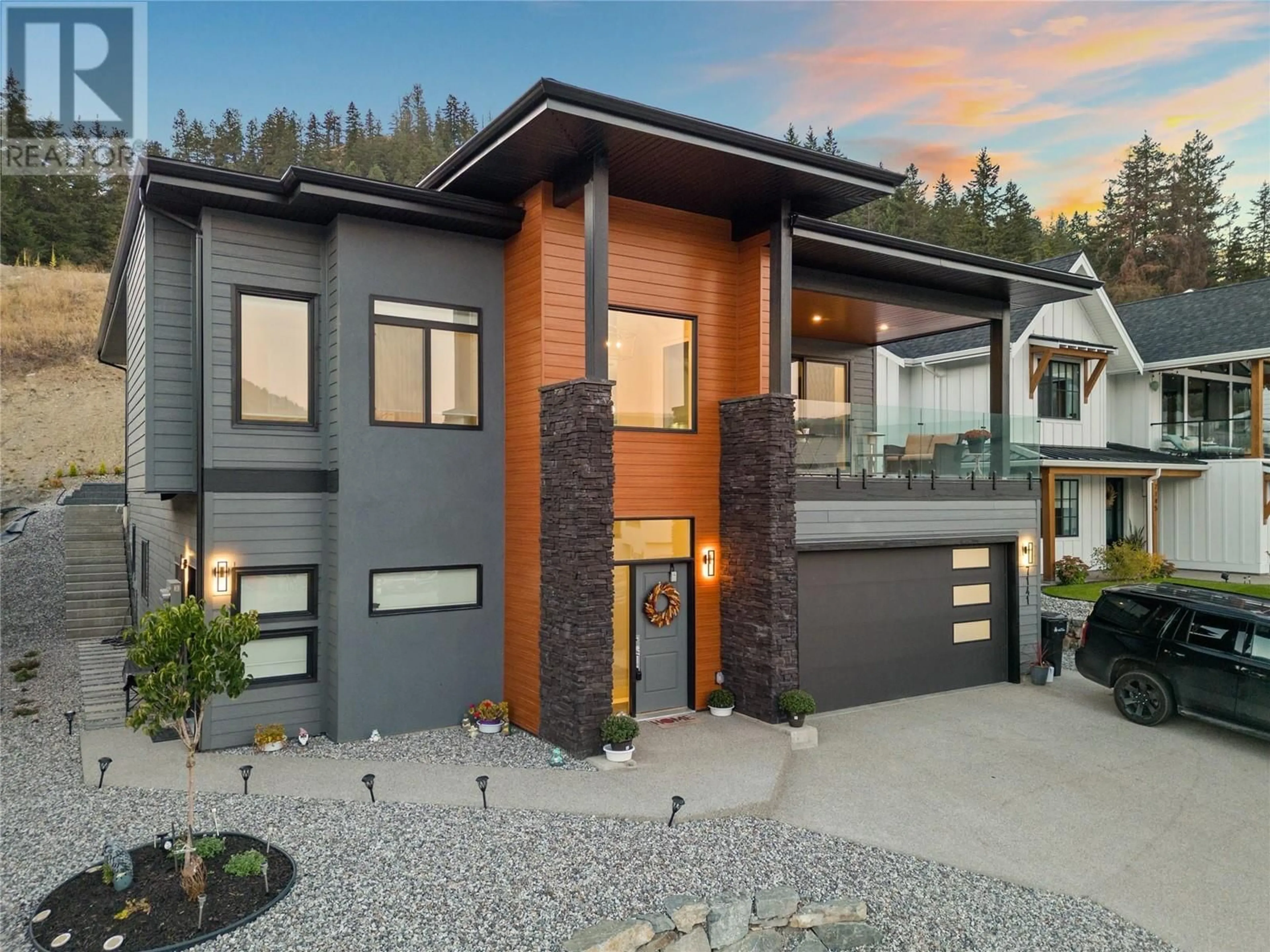 Home with brick exterior material, street for 7141 NAKISKA DRIVE, Vernon British Columbia V1B3M5