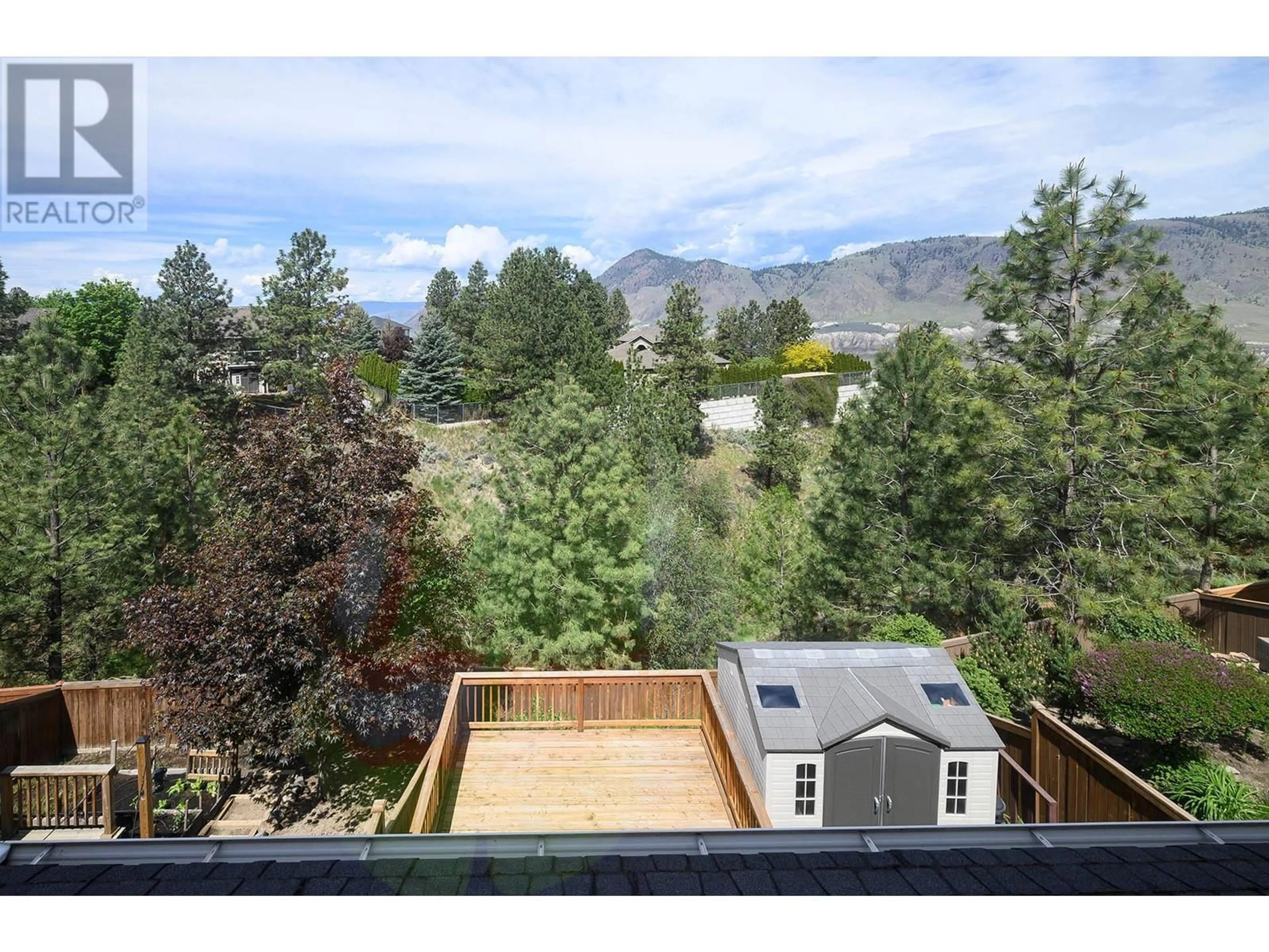 A pic from outside/outdoor area/front of a property/back of a property/a pic from drone, mountain view for 2074 HIGHLAND PLACE, Kamloops British Columbia V2E0E8