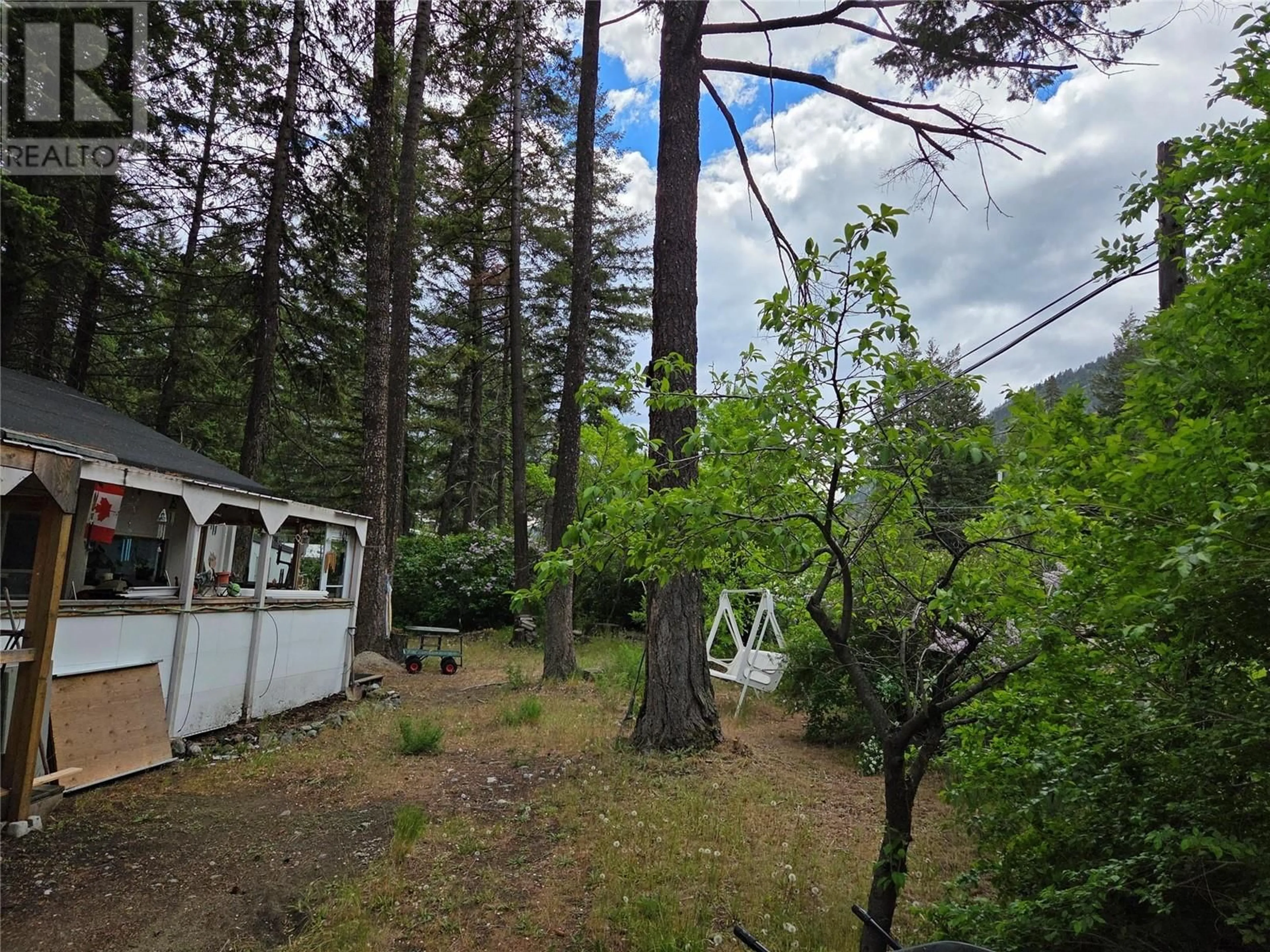 A pic from outside/outdoor area/front of a property/back of a property/a pic from drone, forest/trees view for 15 - 1498 MAIN STREET, Olalla British Columbia V0X1N6