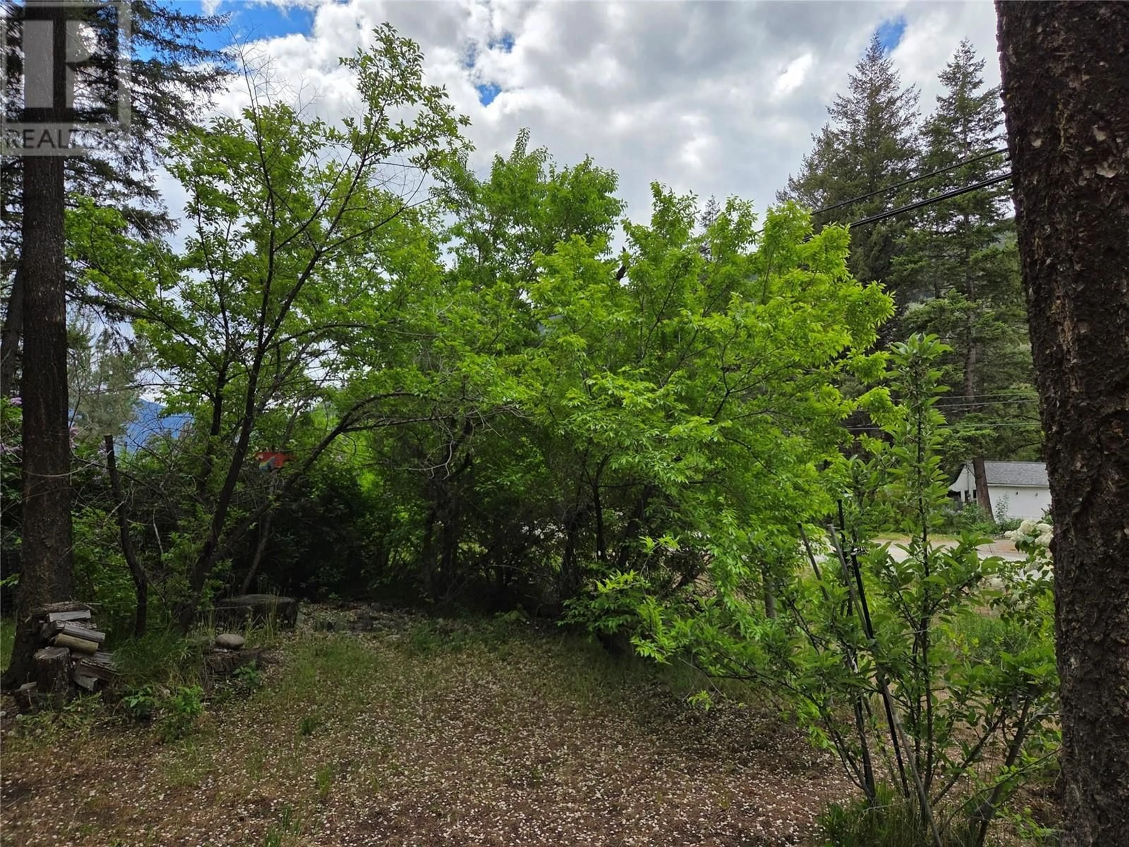 A pic from outside/outdoor area/front of a property/back of a property/a pic from drone, forest/trees view for 15 - 1498 MAIN STREET, Olalla British Columbia V0X1N6