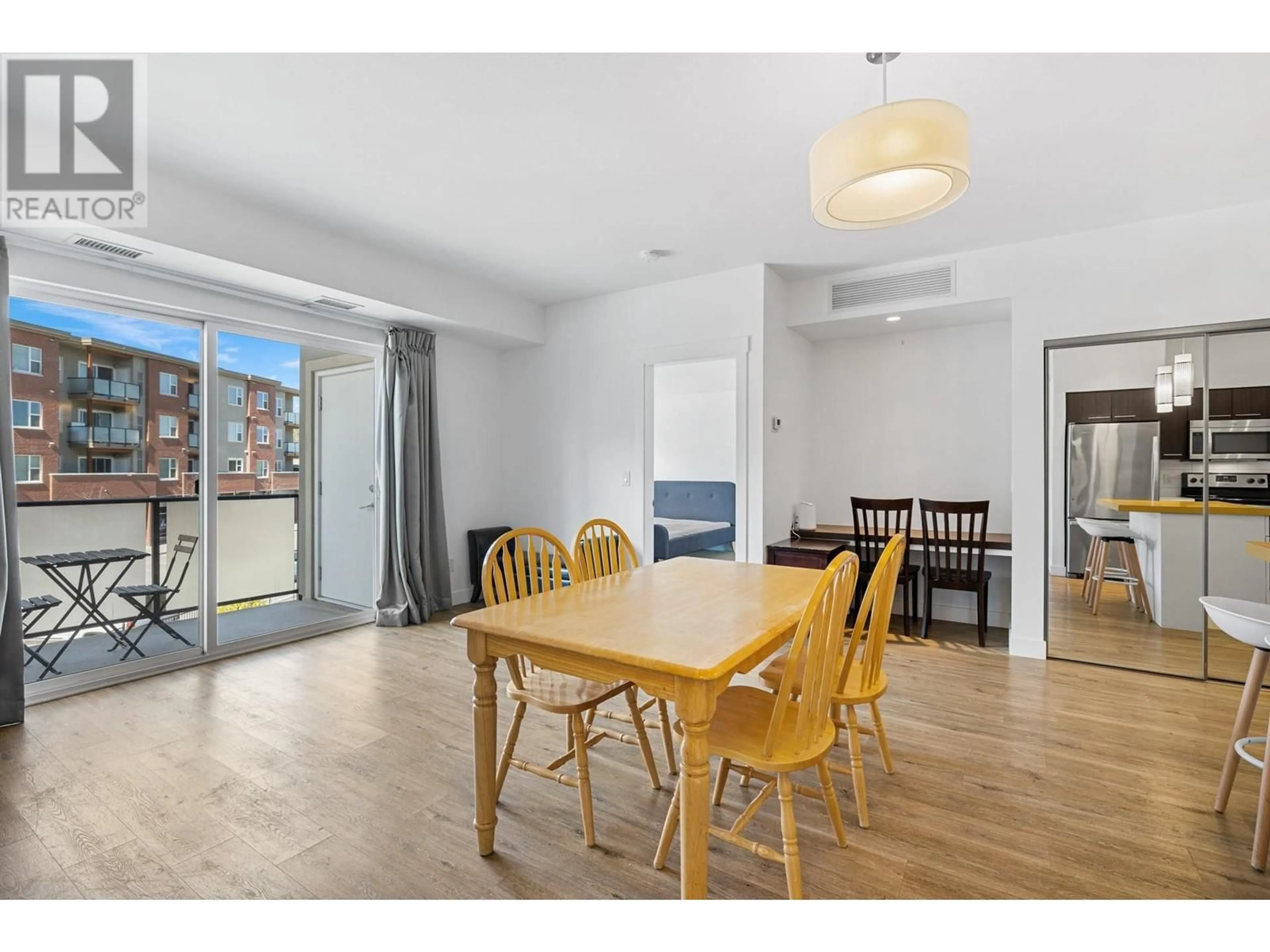 Dining room, wood/laminate floor for 308 - 985 ACADEMY WAY, Kelowna British Columbia V1V3C8