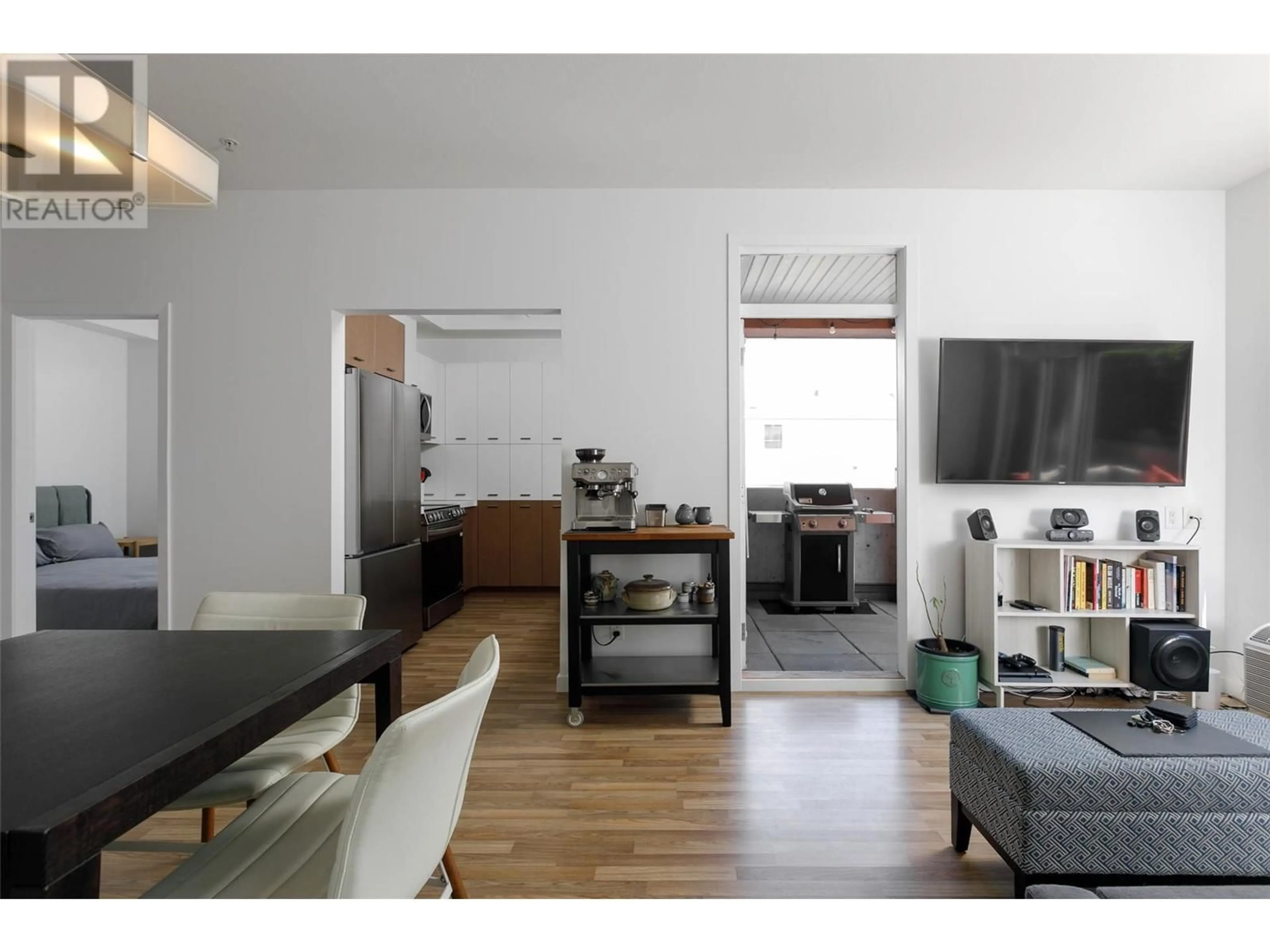 Open concept kitchen, wood/laminate floor for 110 - 1550 DICKSON AVENUE, Kelowna British Columbia V1Y9Y8