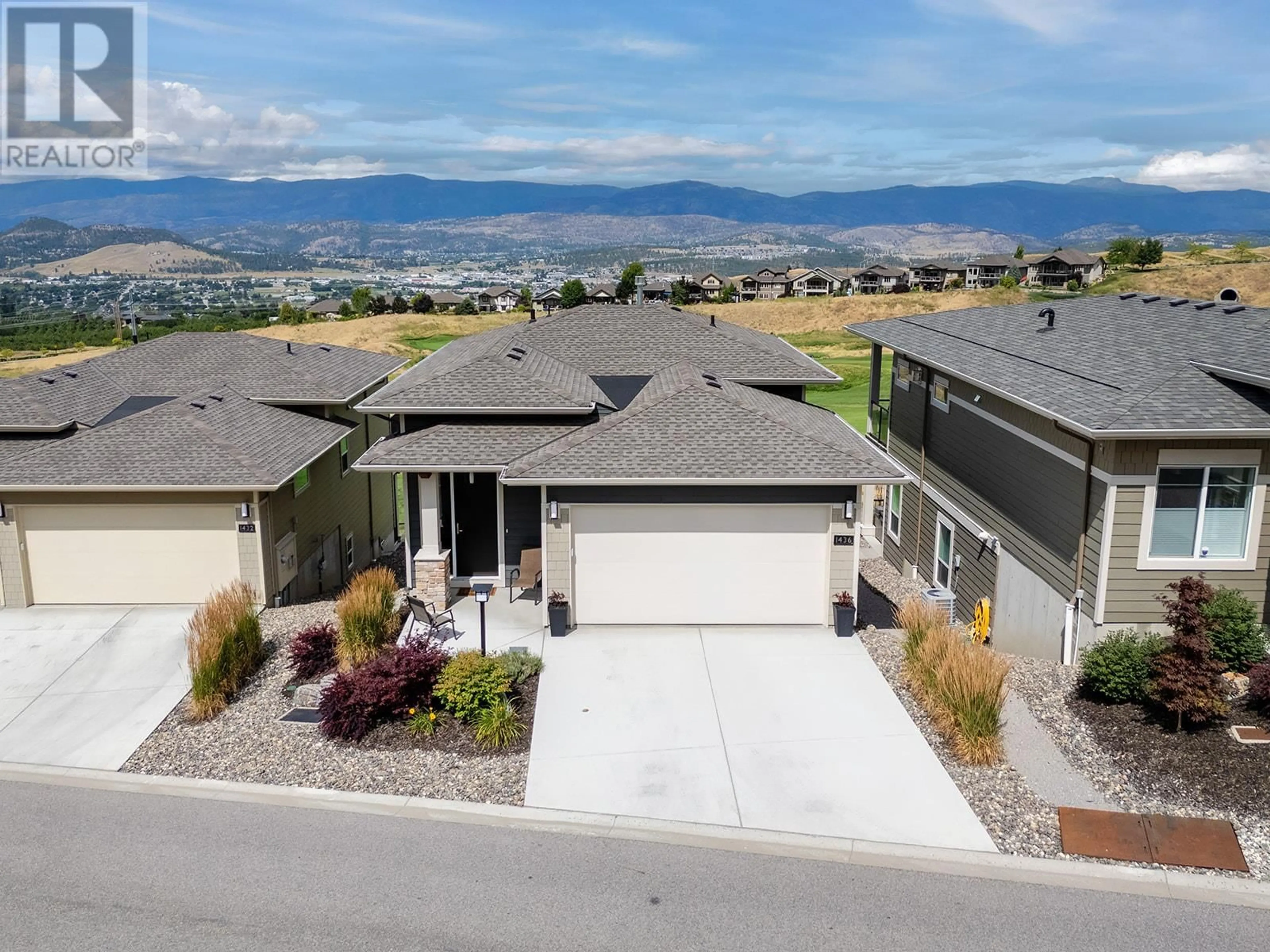 A pic from outside/outdoor area/front of a property/back of a property/a pic from drone, mountain view for 1436 TOWER RANCH DRIVE, Kelowna British Columbia V1P1T8