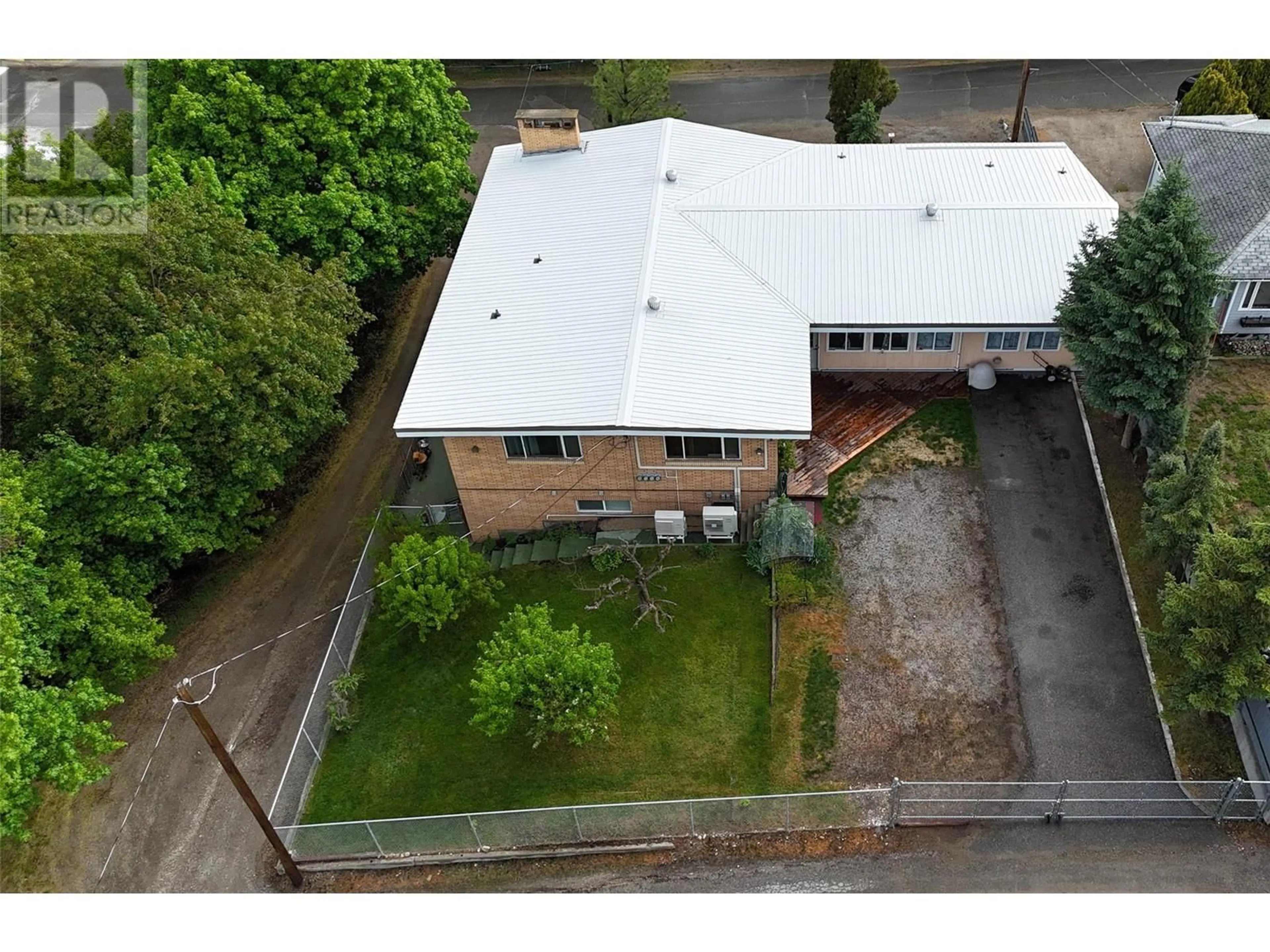 A pic from outside/outdoor area/front of a property/back of a property/a pic from drone, building for 7355 7TH STREET, Grand Forks British Columbia V0H1H0