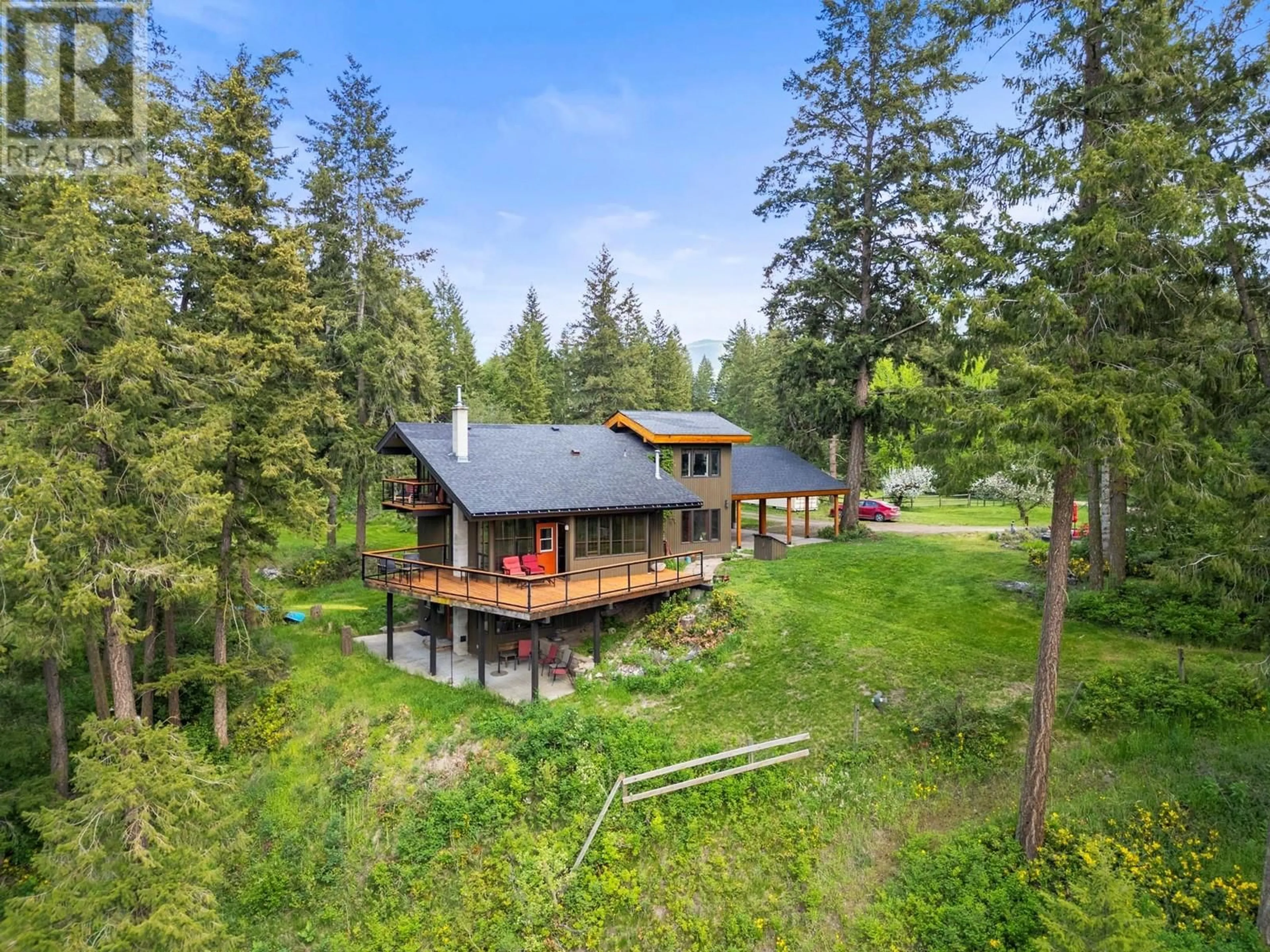 A pic from outside/outdoor area/front of a property/back of a property/a pic from drone, forest/trees view for 4444 HALES ROAD, Spallumcheen British Columbia V4Y0N6