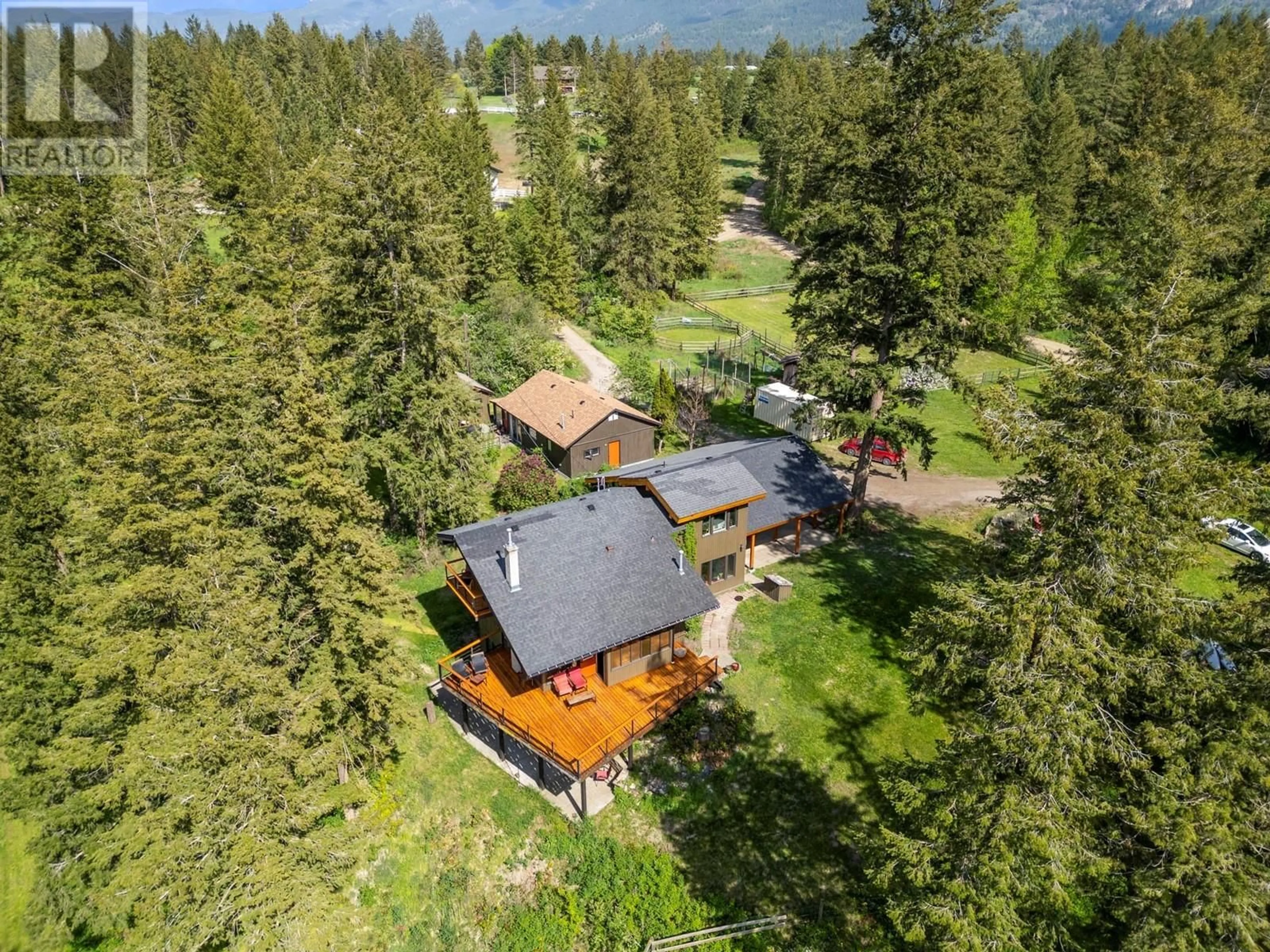 A pic from outside/outdoor area/front of a property/back of a property/a pic from drone, forest/trees view for 4444 HALES ROAD, Spallumcheen British Columbia V4Y0N6