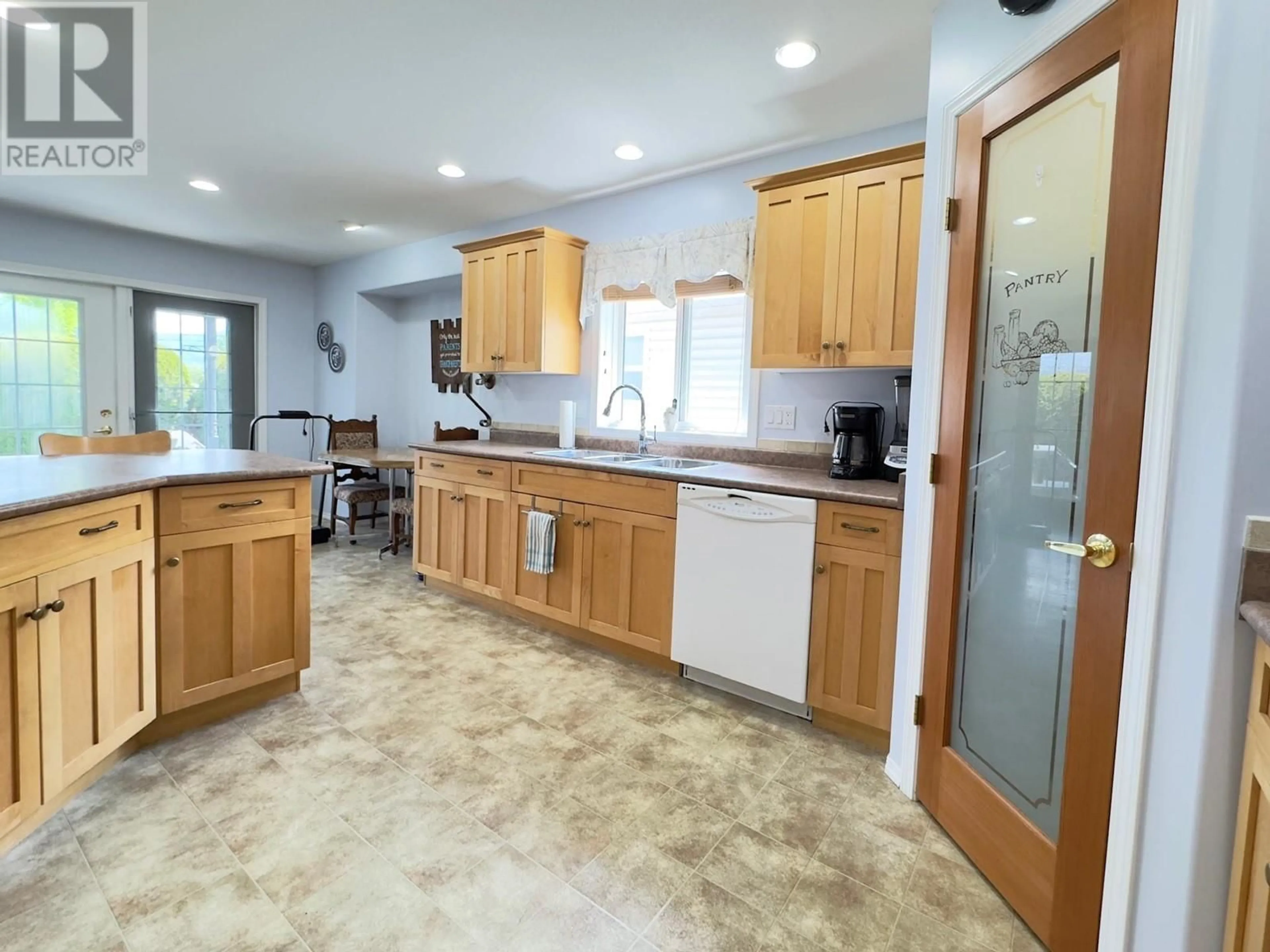 Open concept kitchen, ceramic/tile floor for 556 RED WING DRIVE, Penticton British Columbia V2A8K6