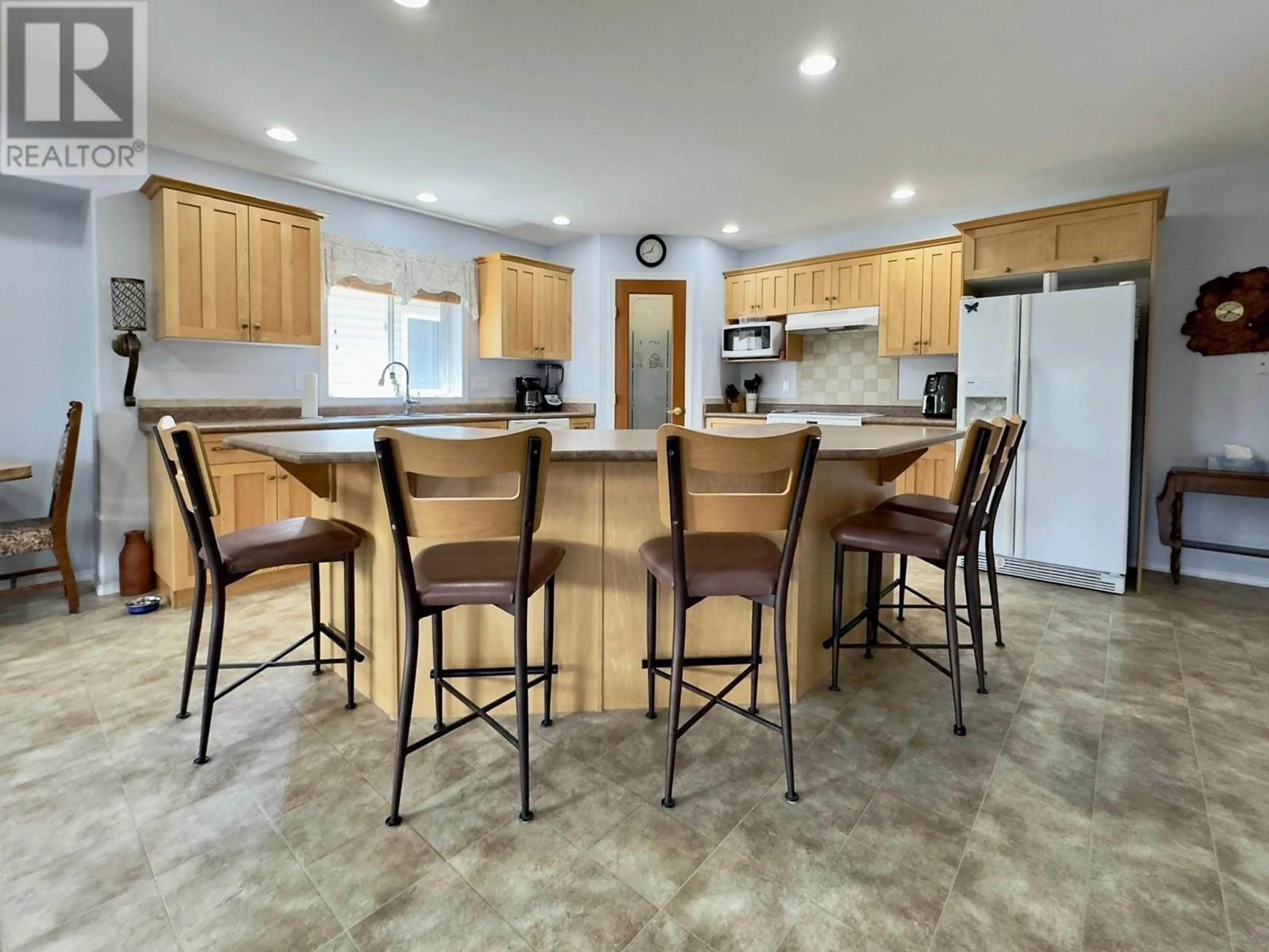 Open concept kitchen, ceramic/tile floor for 556 RED WING DRIVE, Penticton British Columbia V2A8K6