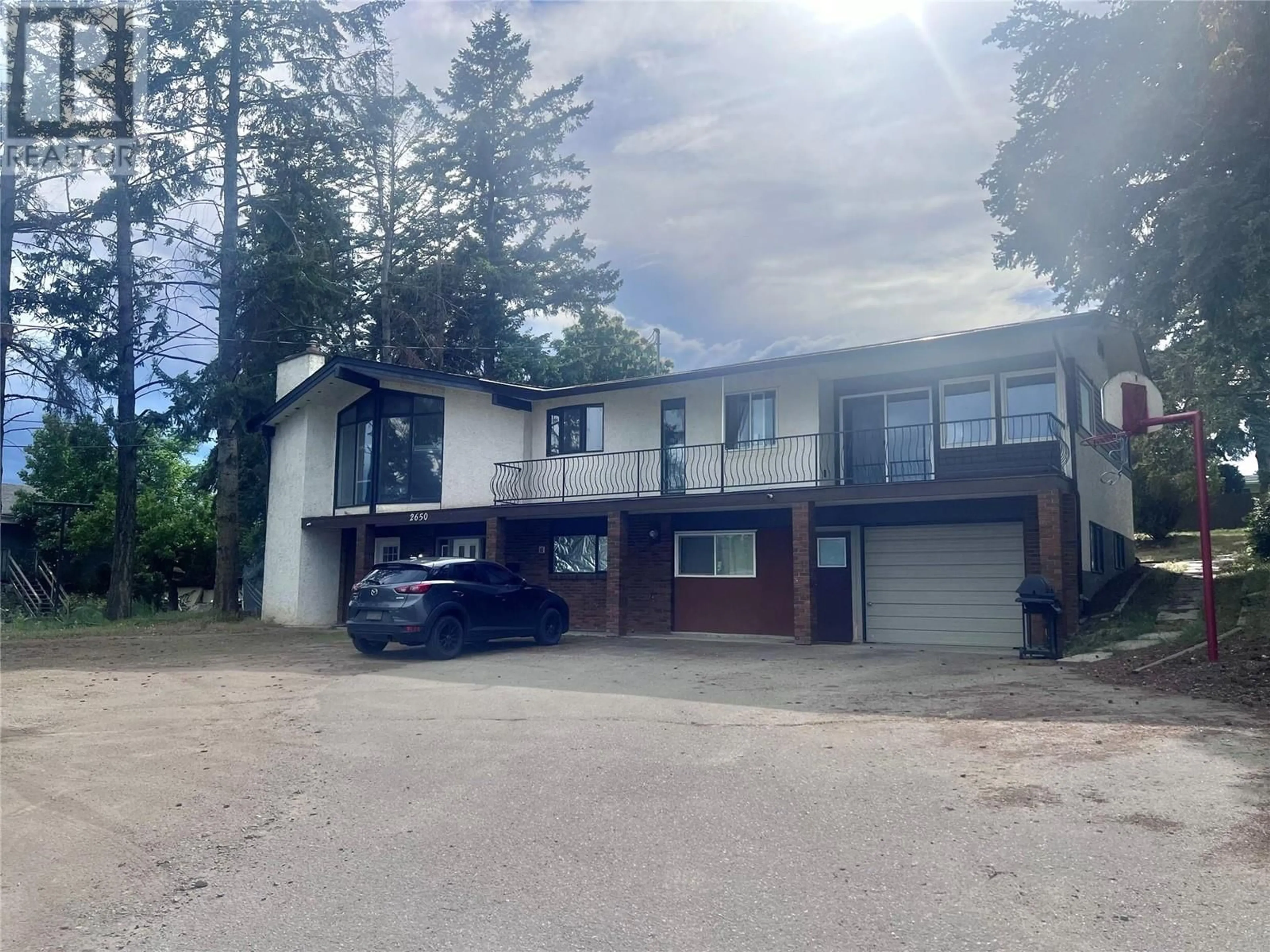 A pic from outside/outdoor area/front of a property/back of a property/a pic from drone, street for 2650 THACKER DRIVE, West Kelowna British Columbia V1Z1W3