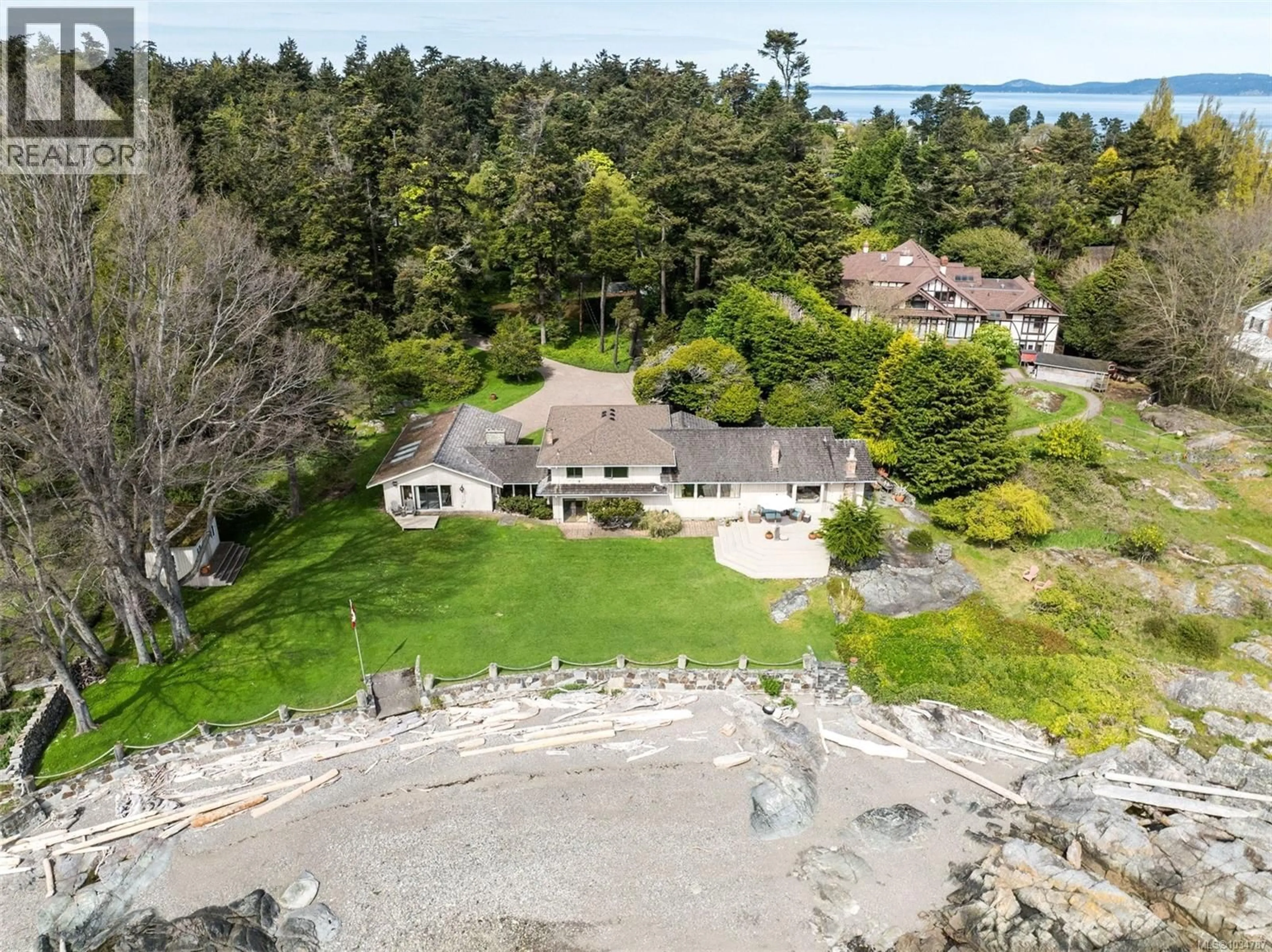 A pic from outside/outdoor area/front of a property/back of a property/a pic from drone, water/lake/river/ocean view for 3035 MCANALLY ROAD, Saanich British Columbia V8N4L3