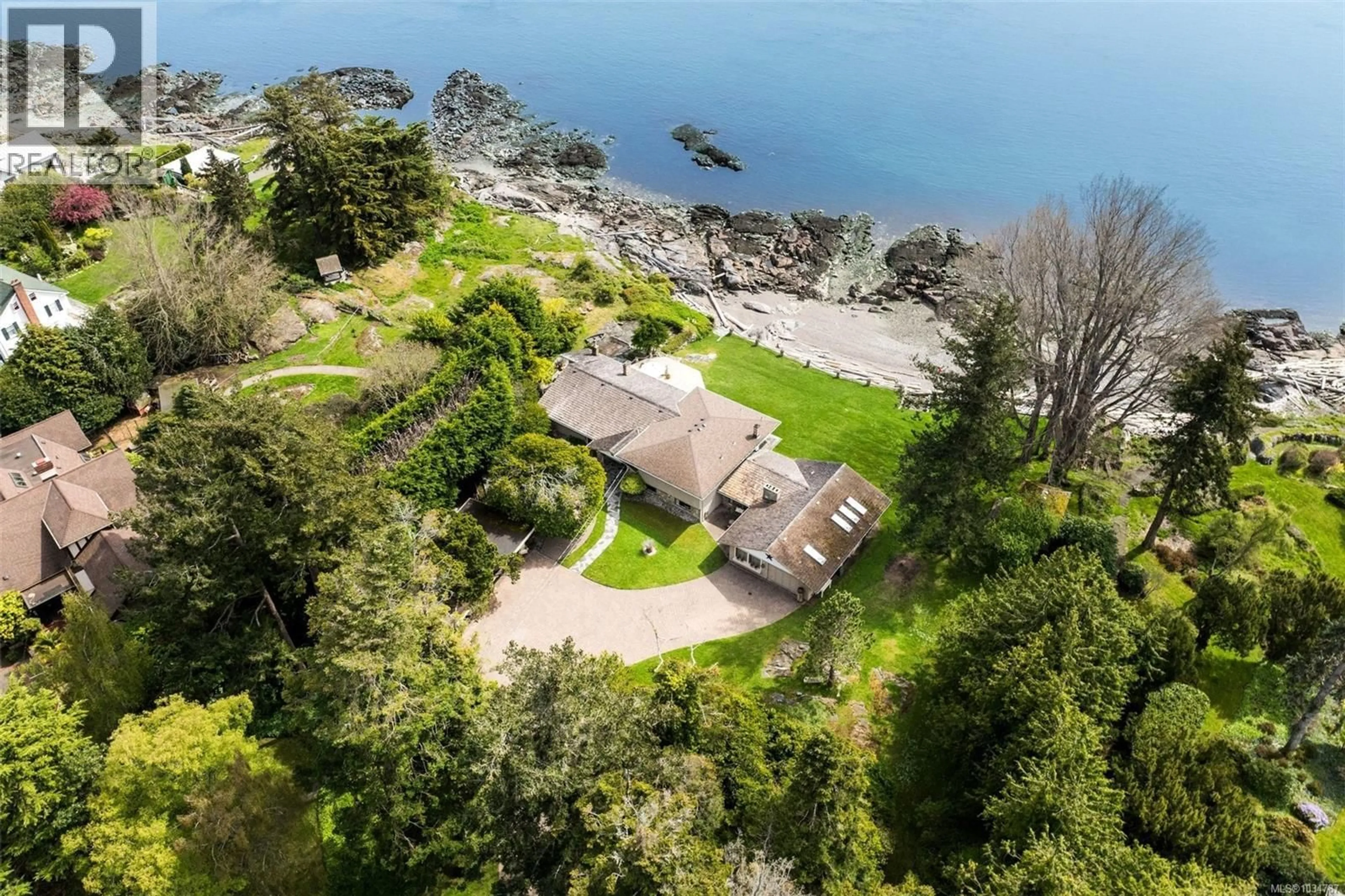 A pic from outside/outdoor area/front of a property/back of a property/a pic from drone, water/lake/river/ocean view for 3035 MCANALLY ROAD, Saanich British Columbia V8N4L3