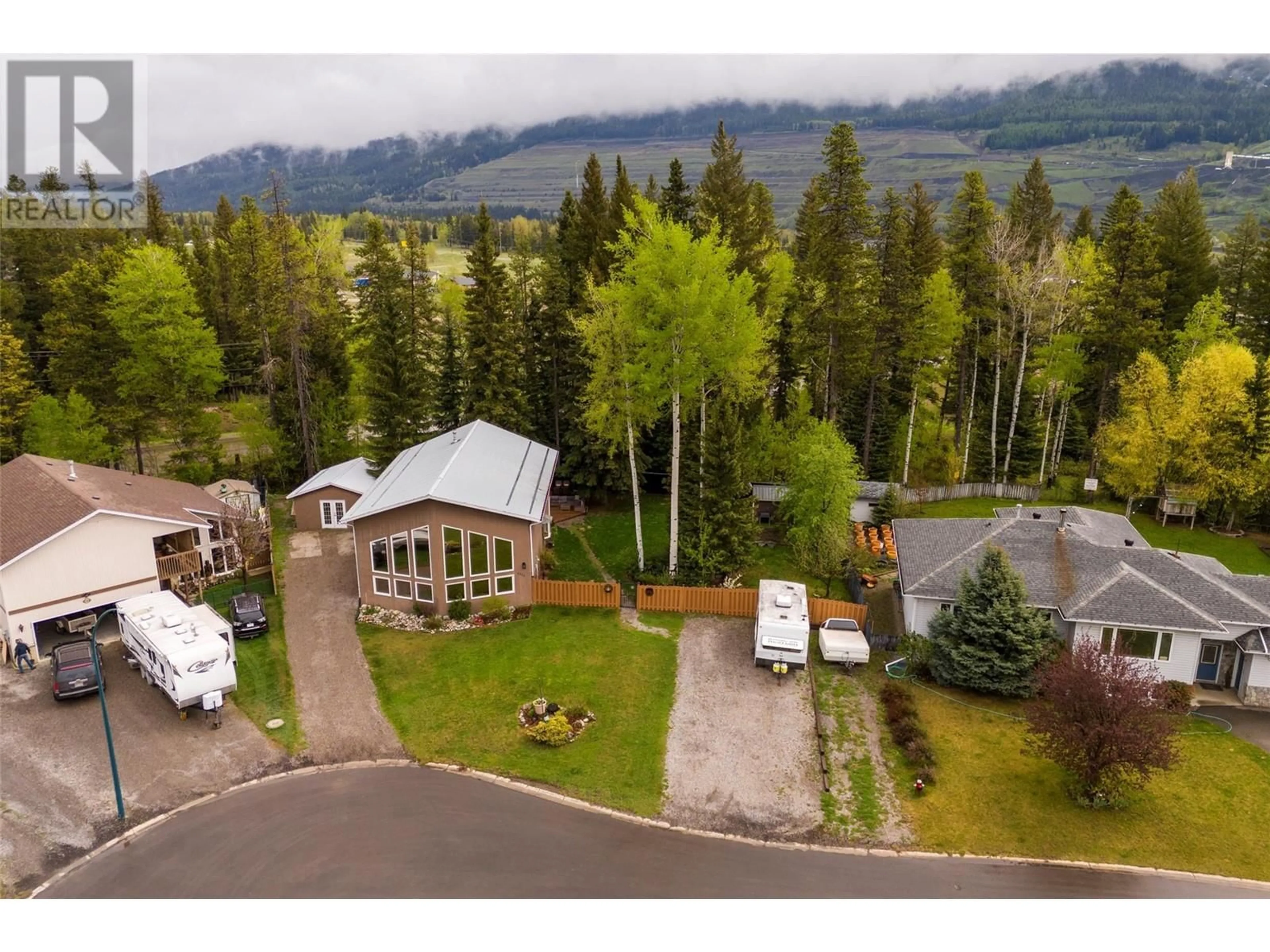 A pic from outside/outdoor area/front of a property/back of a property/a pic from drone, mountain view for 1311 CYPRESS PLACE, Sparwood British Columbia V0B2G2