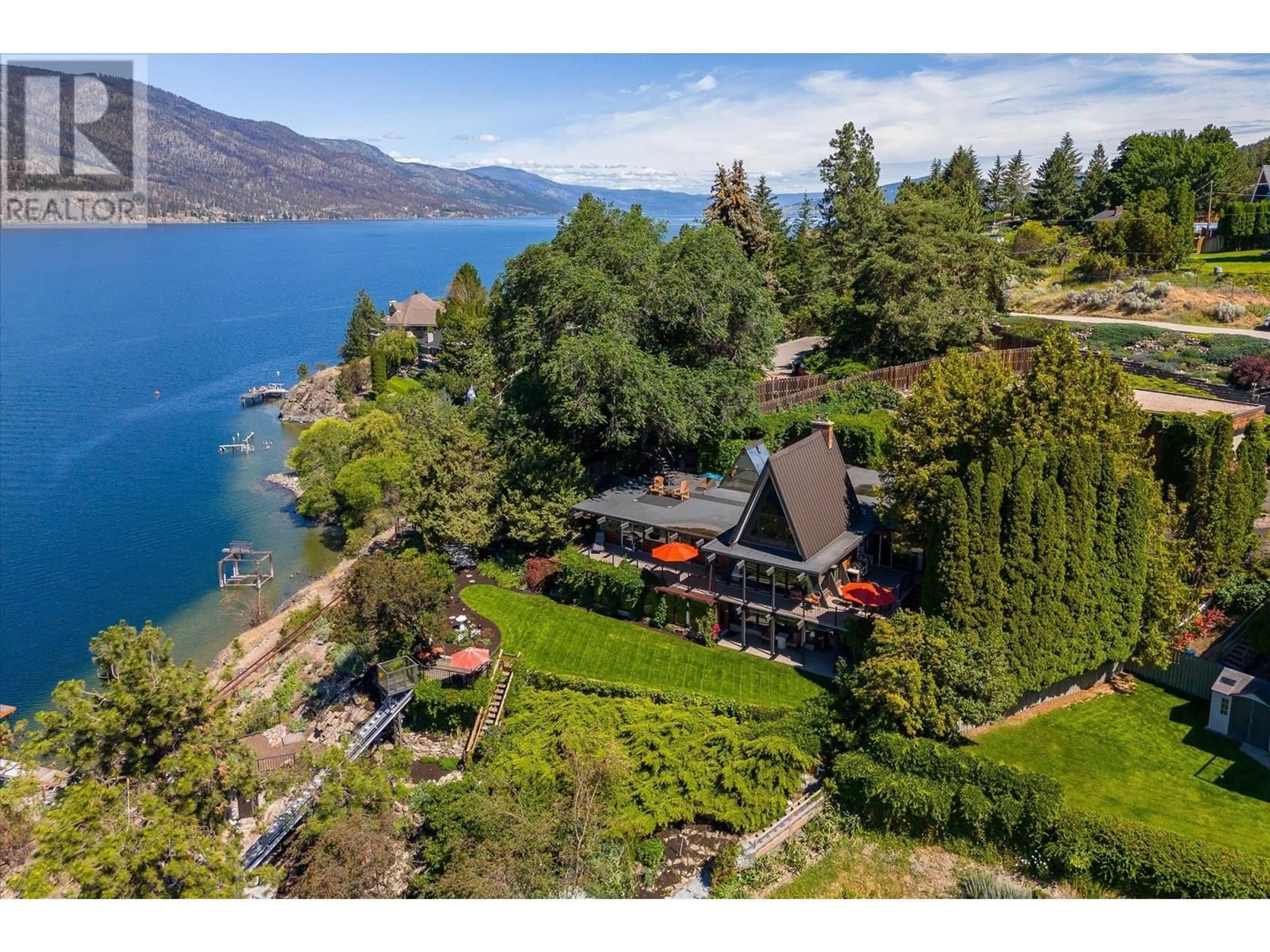 A pic from outside/outdoor area/front of a property/back of a property/a pic from drone, water/lake/river/ocean view for 2004 DEWDNEY ROAD, Kelowna British Columbia V1V2C3